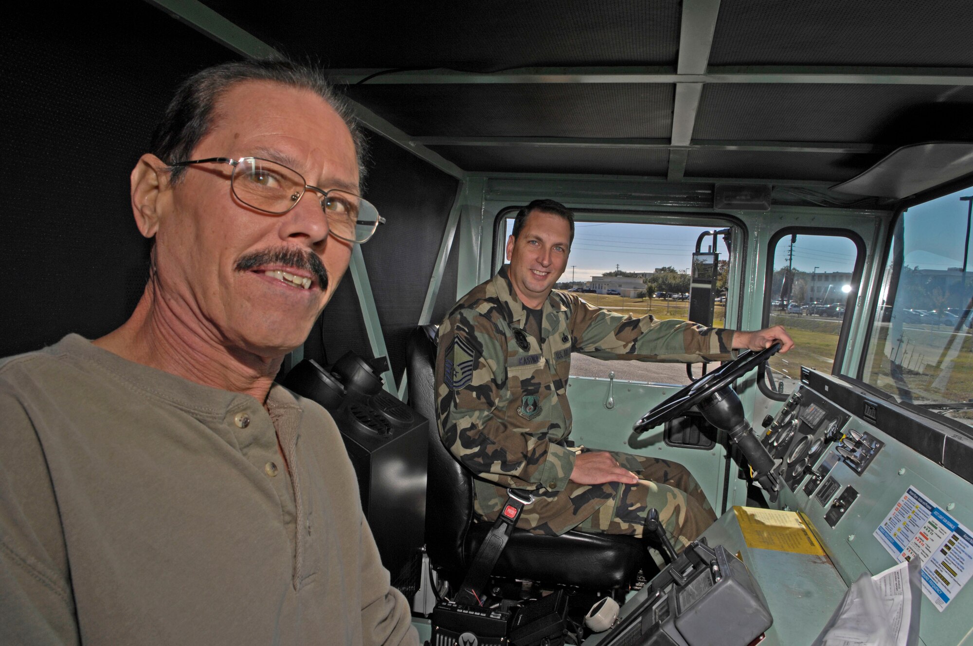 EGLIN AIR FORCE BASE, Fla. -- John Gallucci and Senior Master Sgt. Scott Kaster, 96th Logistics Readiness Squadron's Fuels Flight, prepare for their last run to refuel an aircraft here.  They made their first run together 23 years ago at Griffiss AFB, N. Y., when Sergeant Kastner was an Airman basic.