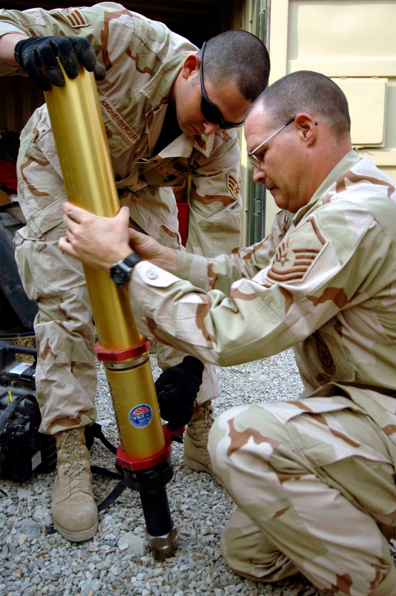 FORWARD OPERATING BASE FENTY, Afghanistan - Master Sgt. Gary Clavin (right) and Senior Airman Jefferey Kronenberger, fire fighters here, perform an inspection of extrication equipment, Nov. 10, 2007.  Thousands of Airmen serve in a variety of missions across Afghanistan, helping to ensure the success of Coalition efforts to bring security and stability to the Afghan people.  (U.S. Air Force photo by Staff Sgt. Joshua Jasper)
