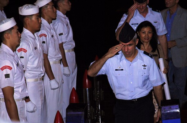 Republic of Korea Naval Honor Guard Members stand at attention as Col. JJ Torres, 15th Airlift Wing commander, boards their ship for the Korean Naval Academy's Cruise Training Force 2007 reception at Naval Base Pearl Harbor. (U.S. Air Force photo/Staff Sgt. Erin Smith)


