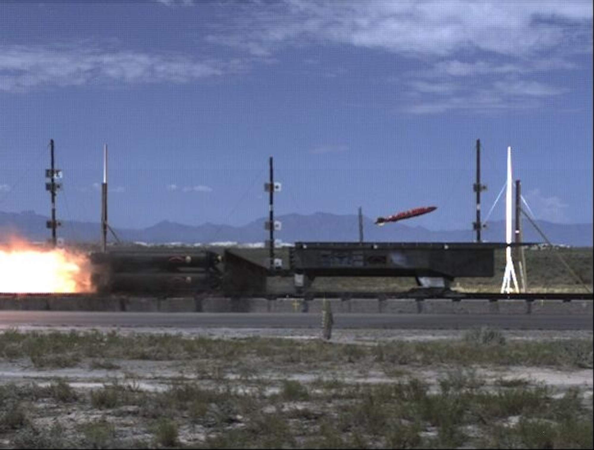 A rocket sled employing active flow control successfully releases a MK-82 Joint Direct Attack Munition Standard Test Vehicle from a weapons bay at a speed of about Mach 2 (twice the speed of sound) during a test conducted by Boeing Phantom Works and the U.S. Air Force Research Laboratory at the High-Speed Test Track at Holloman Air Force Base, N.M. It was the first time that a munition had been released safely from a weapons bay at high supersonic speeds. (U.S. Air Force photo)