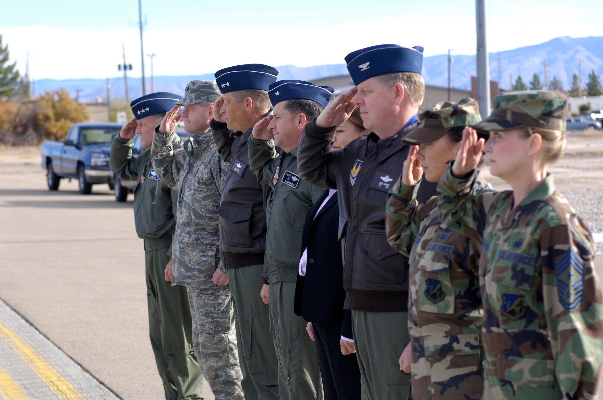 Distinguished guests, U.S. Air Force Lt. Gen. Norman Seip; 12th Air Force Commander, salute the arrival of Michael Wynne, Secritary of the Air Force (SECAF) to land at Holloman AFB, New Mexico, 06 Dec. 2007The SECAF visited Holloman as part of his visit to White Sands Missile range. (U.S. Air Force Photo/SSgt Jason Colbert)