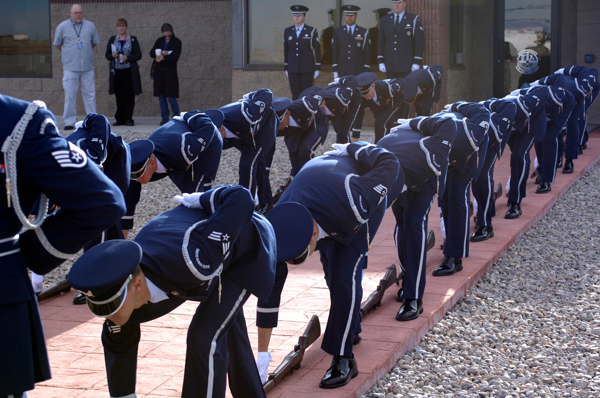 Members of the 49th Fighter Wing Steel Talons Base Honor Guard pick up their rifles in preparation of the arrival of Michael Wynne, Secretary of the Air Force (SECAF) to land at Holloman AFB, New Mexico, 06 Dec. 2007.The SECAF visited Holloman as part of his visit to White Sands Missile range. (U.S. Air Force Photo/SSgt Jason Colbert)