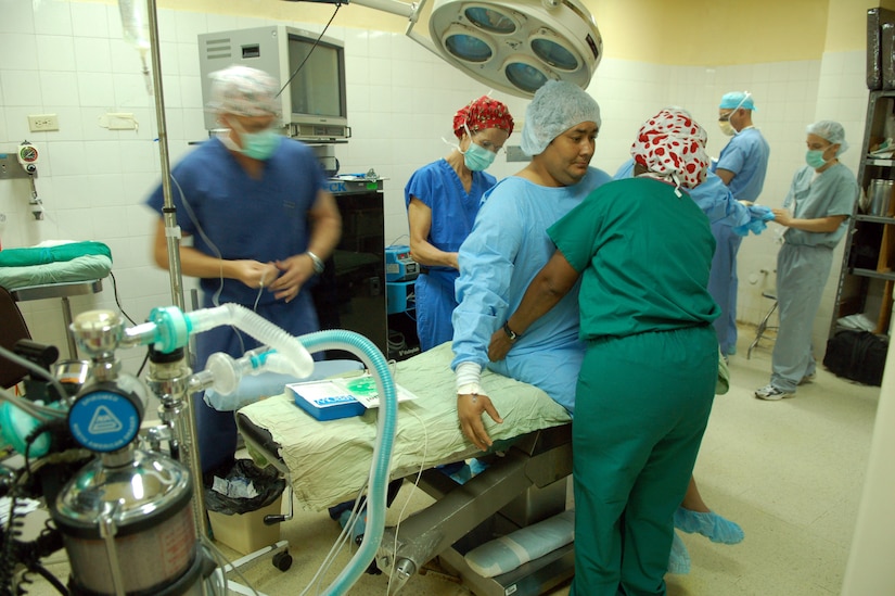 COMAYAGUA, Honduras – Doctors, nurses and medical technicians from the Joint Task Force-Bravo Medical Element prepare a patient and operating room for surgery during a Medical Readiness Training Exercise Dec. 5.  MEDEL surgeons usually perform surgical MEDRETES twice a week in towns near Soto Cano Air Base.  (U.S. Air Force photo by Staff Sgt. Austin M. May)