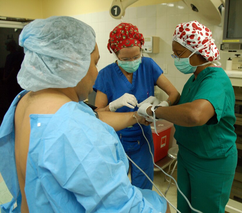 COMAYAGUA, Honduras – Air Force Majors Donnell Nicks and Irene Cassidy, operating room nurses with the Joint Task Force-Bravo Medical Element, prepare a patient for surgery during a Medical Readiness Training Exercise Dec. 5.  MEDEL surgeons usually perform surgical MEDRETES twice a week in towns near Soto Cano Air Base.  (U.S. Air Force photo by Staff Sgt. Austin M. May)