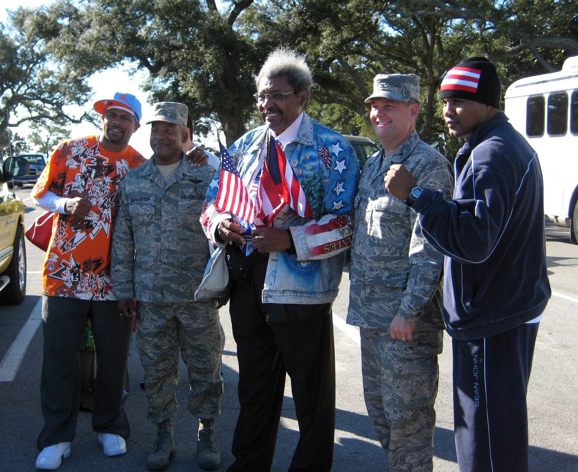 Boxer Roy Jones Jr. (left to right), Chief Master Sgt. Jeffrey Richardson, boxing promoter Don King, Col. Brad Webb and boxer Felix Trinidad pose in the parking lot of The Soundside before the boxing trio sets off on a Dec. 5 tour of Hurlburt Field, Fla. The boxers and their promoter visited Hurlburt Field as part of their tour of military installations to show support for military members. Chief Richardson is the 1st Special Operations Wing command chief, and Colonel Webb is the 1st SOW commander (U.S. Air Force photo/Tech. Sgt. Angela Shepherd)