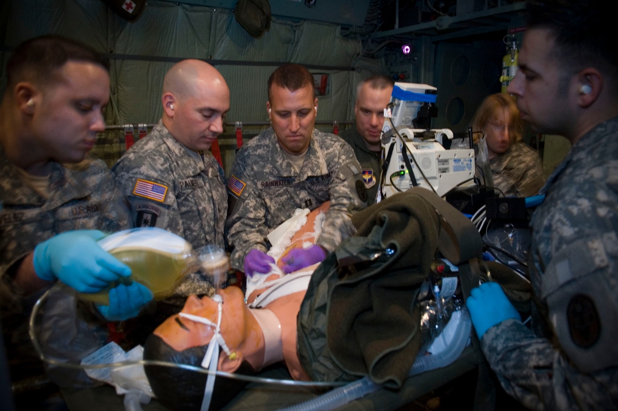 Special Medical Augmentation Response Team members based at Brooke Army Medical Center, San Antonio, Texas care for a simulated burn patient inside a C-130 aircraft simulator at Brooks City-Base, also in San Antonio. The training is part of Critical Care Air Transport Team training conducted by the United States School of Aerospace Medicine at Brooks. (U.S. Air Force photo/Steve Thurow)