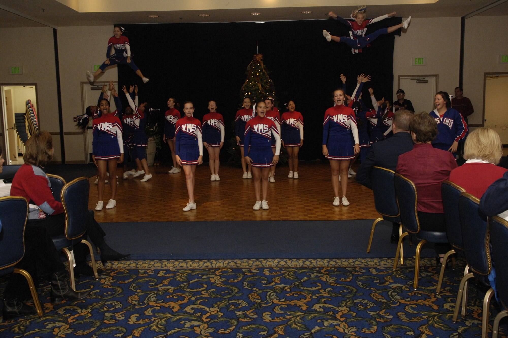 VANDENBERG AIR FORCE BASE, Calif. -- Vandenberg Middle School Cheerleaders perform at Operation Kids Christmas on Dec. 1 in the Pacific Cost Club. Operation Kids Christmas 2007 provided over two-hundred underprivileged children with presents and a holiday dinner. The event was made possible through multiple fund raising events and corporate sponsors. This was the 48th OKC held at Vandenberg.  (U.S. Air Force photo/Airman 1st Class Nichelle Griffiths)