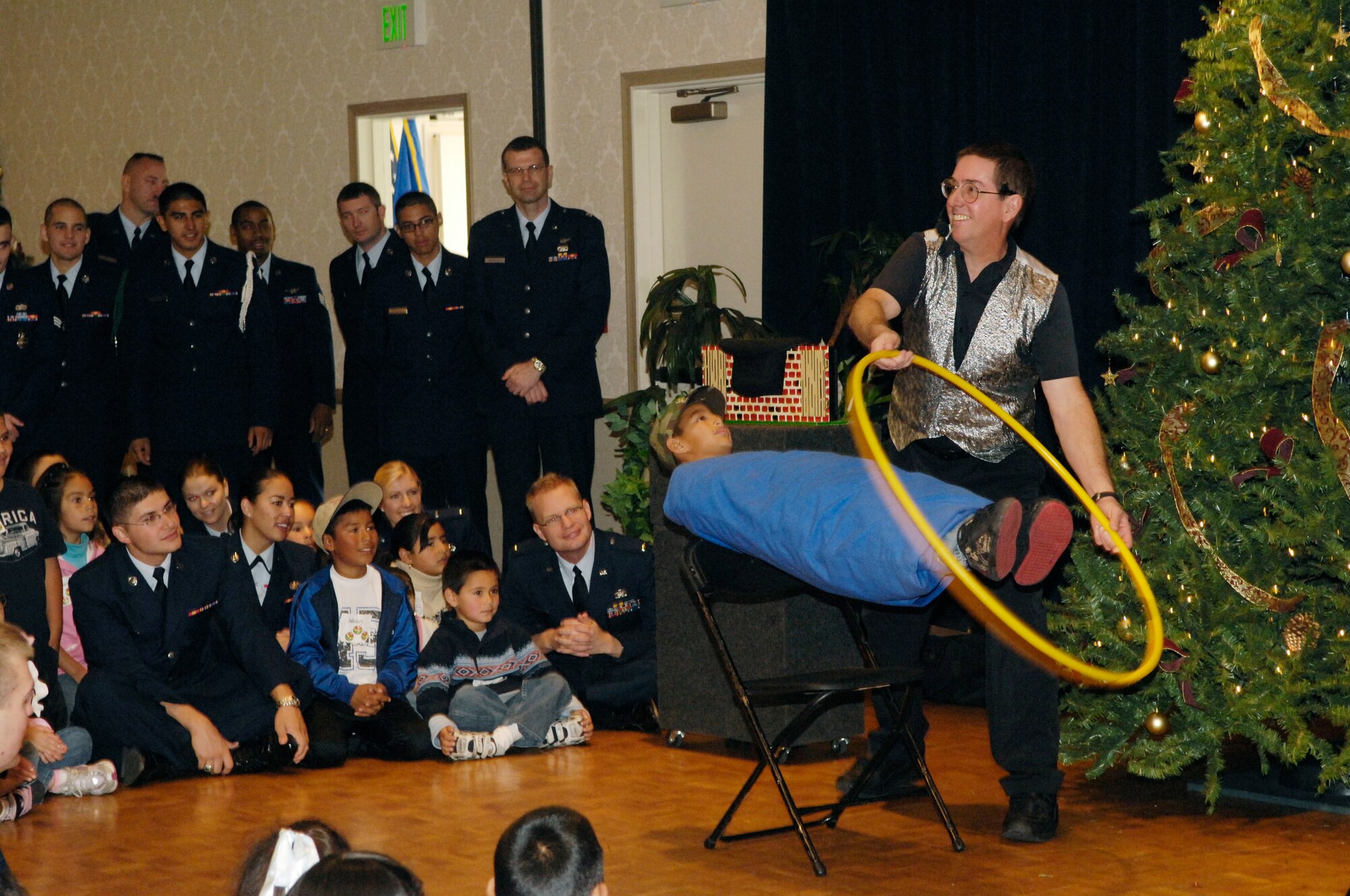 VANDENBERG AIR FORCE BASE, Calif. -- A Magician preforms for the children  during Operation Kids Christmas on Dec. 1 in the Pacific Cost Club. Operation Kids Christmas 2007 provided over two-hundred underprivileged children with presents and a holiday dinner. The event was made possible through multiple fund raising events and corporate sponsors. This was the 48th OKC held at Vandenberg.  (U.S. Air Force photo/Airman 1st Class Nichelle Griffiths)