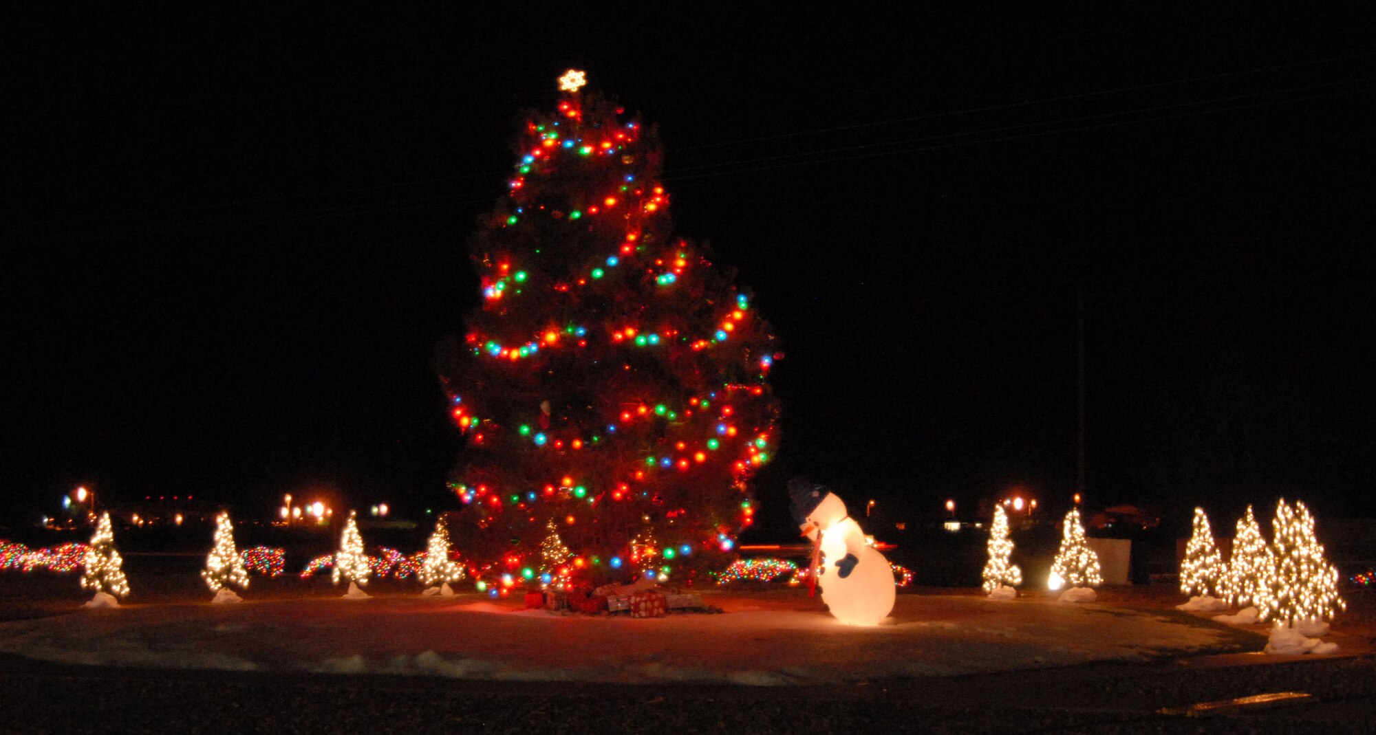 Team Edwards gathered in the Base Exchange parking lot to witness the lighting ceremony of the Christmas tree Dec. 5. The ceremony begins the holiday season at Edwards. (Photo by Senior Airman Julius Delos Reyes)