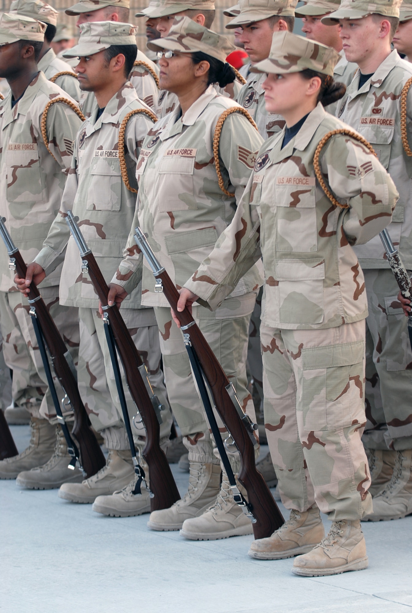 SOUTHWEST ASIA - Members of the 379th Air Expeditionary Wing Honor Guard stand at parade rest during a ceremony Dec. 7 in honor of the attack on Pearl Harbor 66 years ago today at a Southwest Asia air base. (U.S. Air Force photo/Staff Sgt. Doug Olsen)
