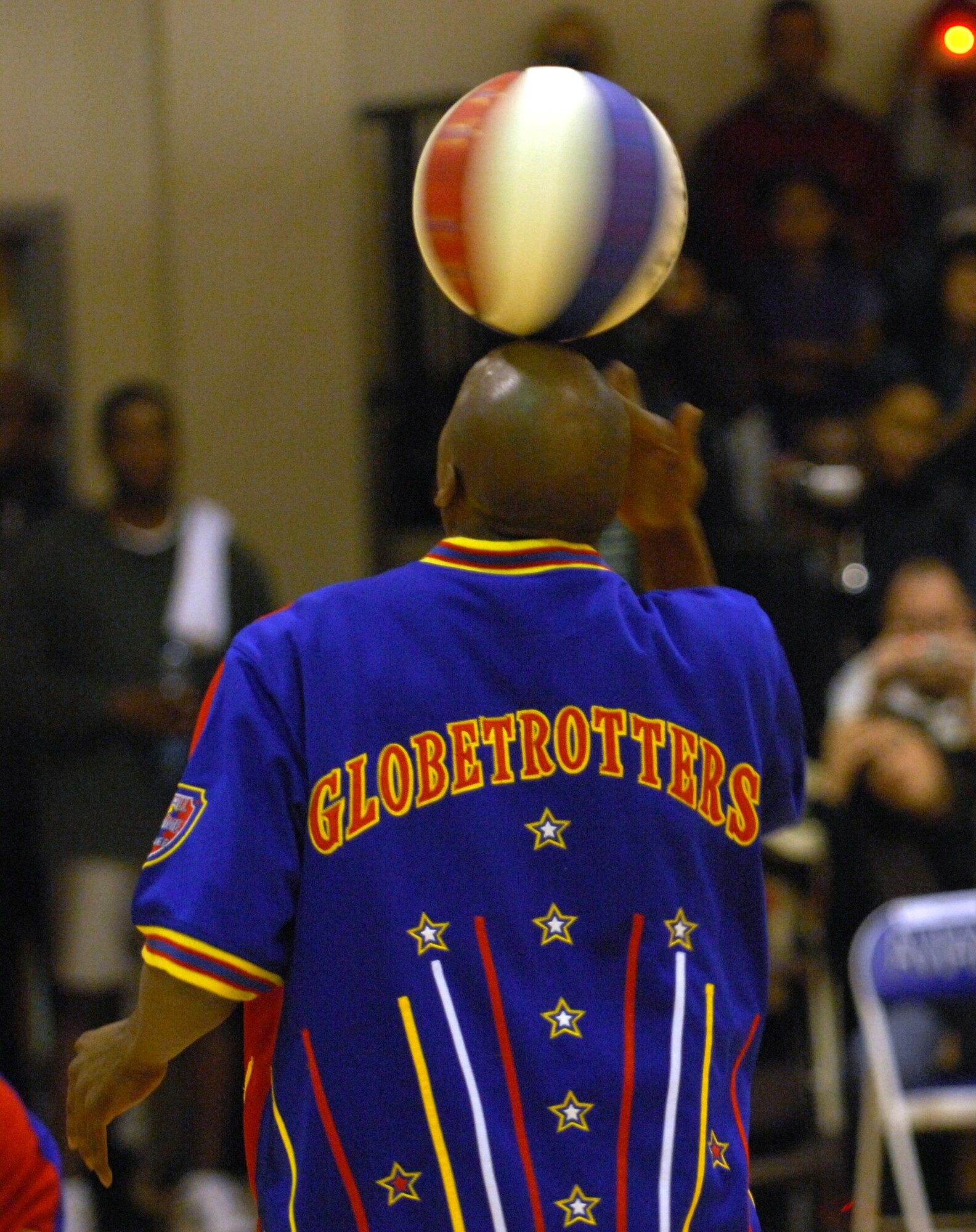The Harlem Globetrotters show off their basketball handling skills before a game Dec. 1 at the Dragon Fitness Center at Aviano Air Base, Italy. The Harlem Globetrotters are touring Army and Air Force installations throughout Europe as part of their "Magic As Ever" 2008 world tour. (U.S. Air Force photo/Staff Sgt. Michael R. Holzworth) 
