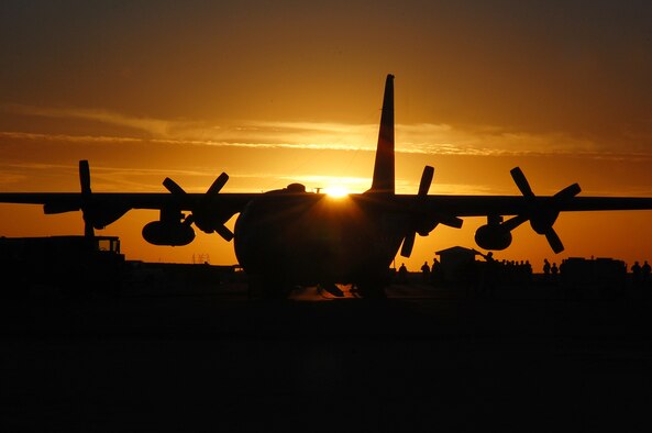 SOUTHWEST ASIA – Servicemembers en route to Iraq prepare to board a C-130 Hercules Nov. 30.  The C-130 is capable of operating from rough, dirt strips and is the prime transport for air dropping troops and equipment into hostile areas.  (Air Force photo by Staff Sgt. Tia Schroeder)