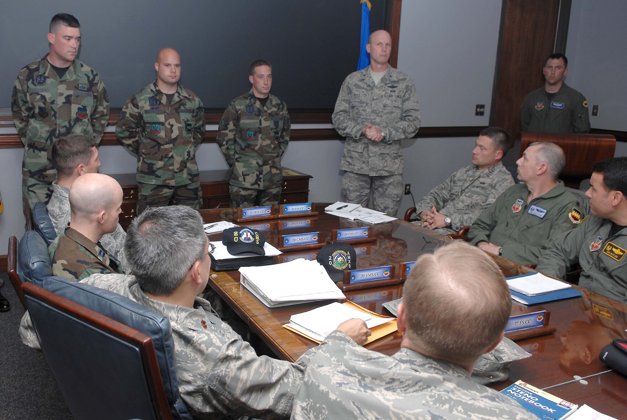 SHAW AIR FORCE BASE, S.C. -- Col. James Post, 20th Fighter Wing commander, presents the Lt. Erwin Shaw Ace Award to crew chiefs (from left to right) Tech. Sgt. Fredric Wilson and Staff Sgts. Lee Walden and Brad Miner, 55th Aircraft Maintenance Unit, during a wing staff meeting Nov. 28. The sergeants earned the award for their quick and accurate emergency response to an aircraft that caught fire. (U.S. Air Force photo/Airman 1st Class Matthew Davis)