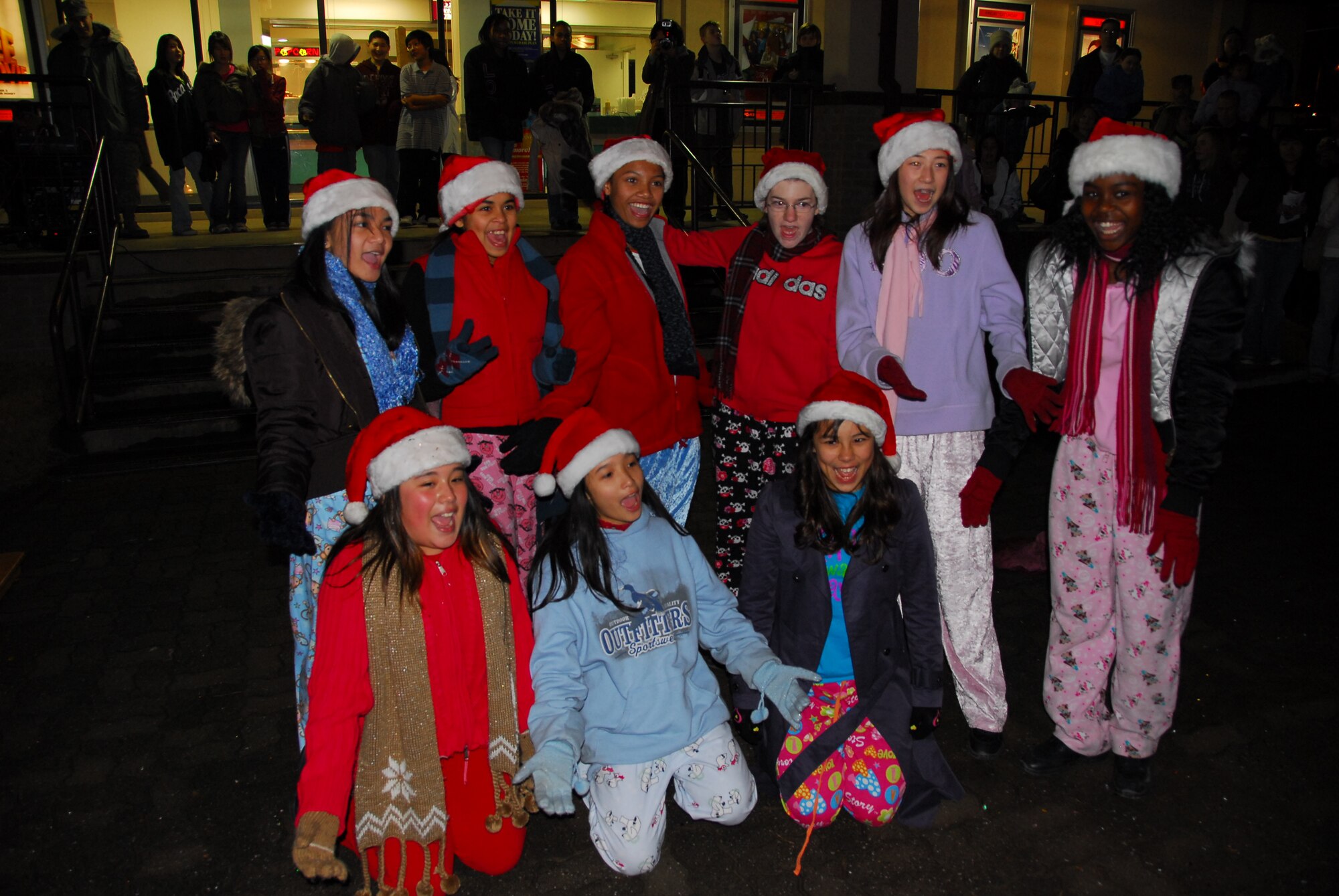 OSAN AIR BASE, Republic of Korea --  Members of Osan Middle School's step and dance team peform during the Christmas tree lighting celelbration in front of the base theater Dec. 6. (U.S. Air Force photo by Staff Sgt. Ronnie Hill)