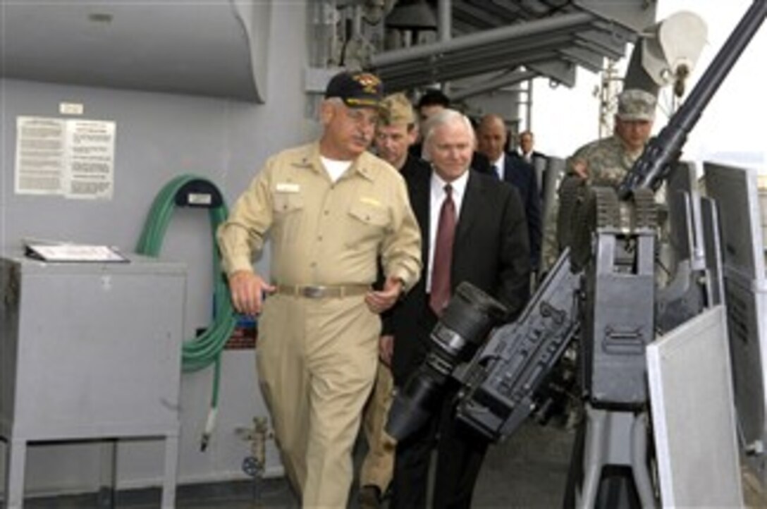 Defense Secretary Robert M. Gates walks with U.S. Navy Capt. Chip Swicker aboard the USS Vicksburg, ported in Bahrain, Dec. 6, 2007. 