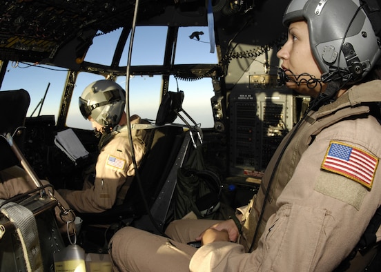 Staff Sgt. Amanda Murdock, a C-130 Hercules flight engineer, monitors various aircraft systems while in flight. Sergeant Murdock is with the 40th Expeditionary Airlift Squadron at an air base in Southwest Asia. The squadron transports passengers and cargo, performs airdrops of equipment and supplies and conducts aeromedical evacuation missions in support of operations Enduring and Iraqi Freedom. (U.S. Air Force photo/Staff Sgt. Angelique Perez)