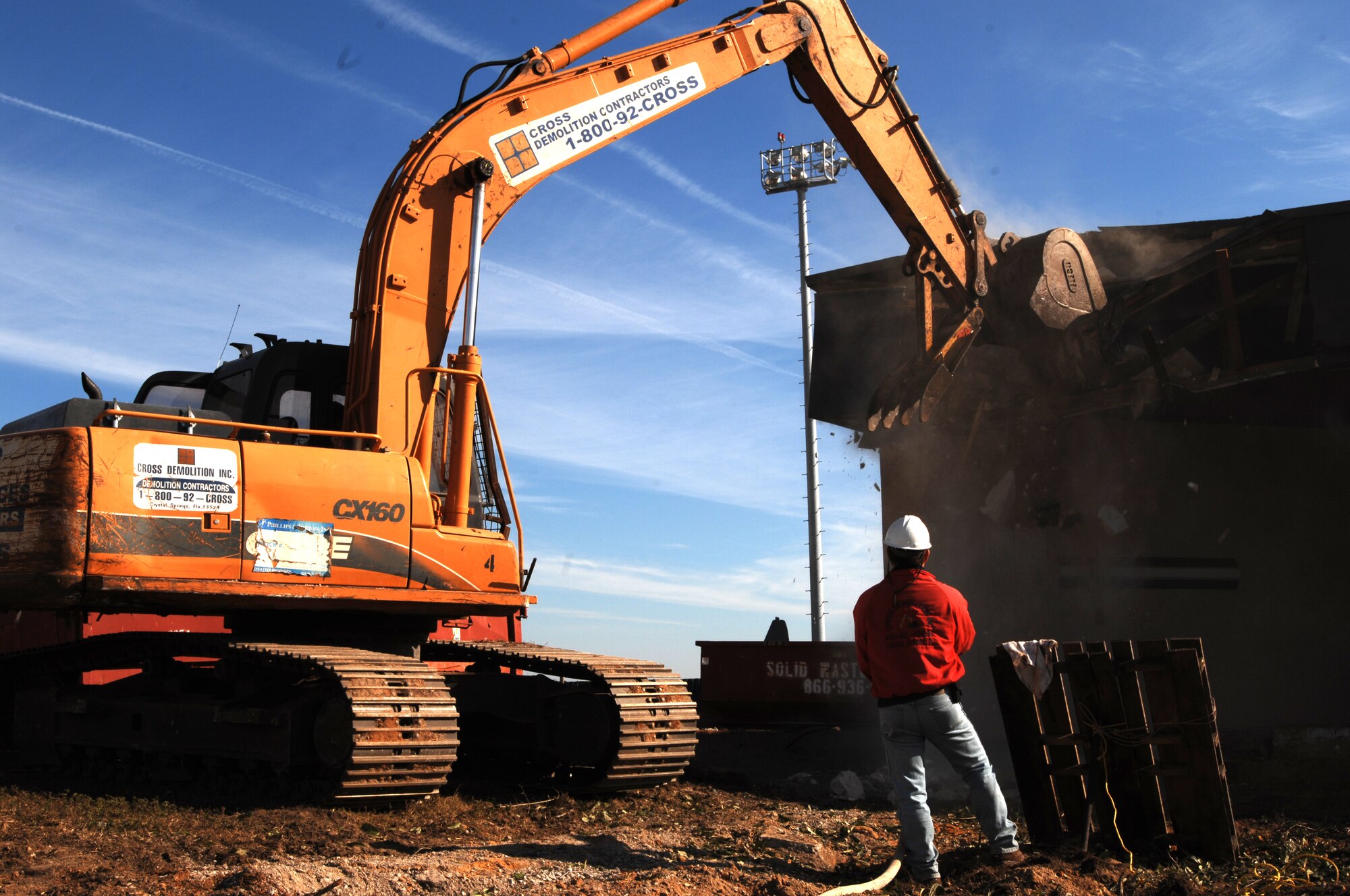 A bulldozer makes its way through the building that formerly housed the 20th Special Operations Squadron and wing plans and programs Dec. 6. The 14,000 square-foot building on Bennett Avenue was built in 1955 and is being demolished to make way for a new crash/rescue facility for the 1st Special Operations Civil Engineer Squadron Fire Emergency Services Flight. Construction on the new facility is expected to be completed in 17 months. (U.S. Air Force photo/Airman 1st Class Jason Epley) 