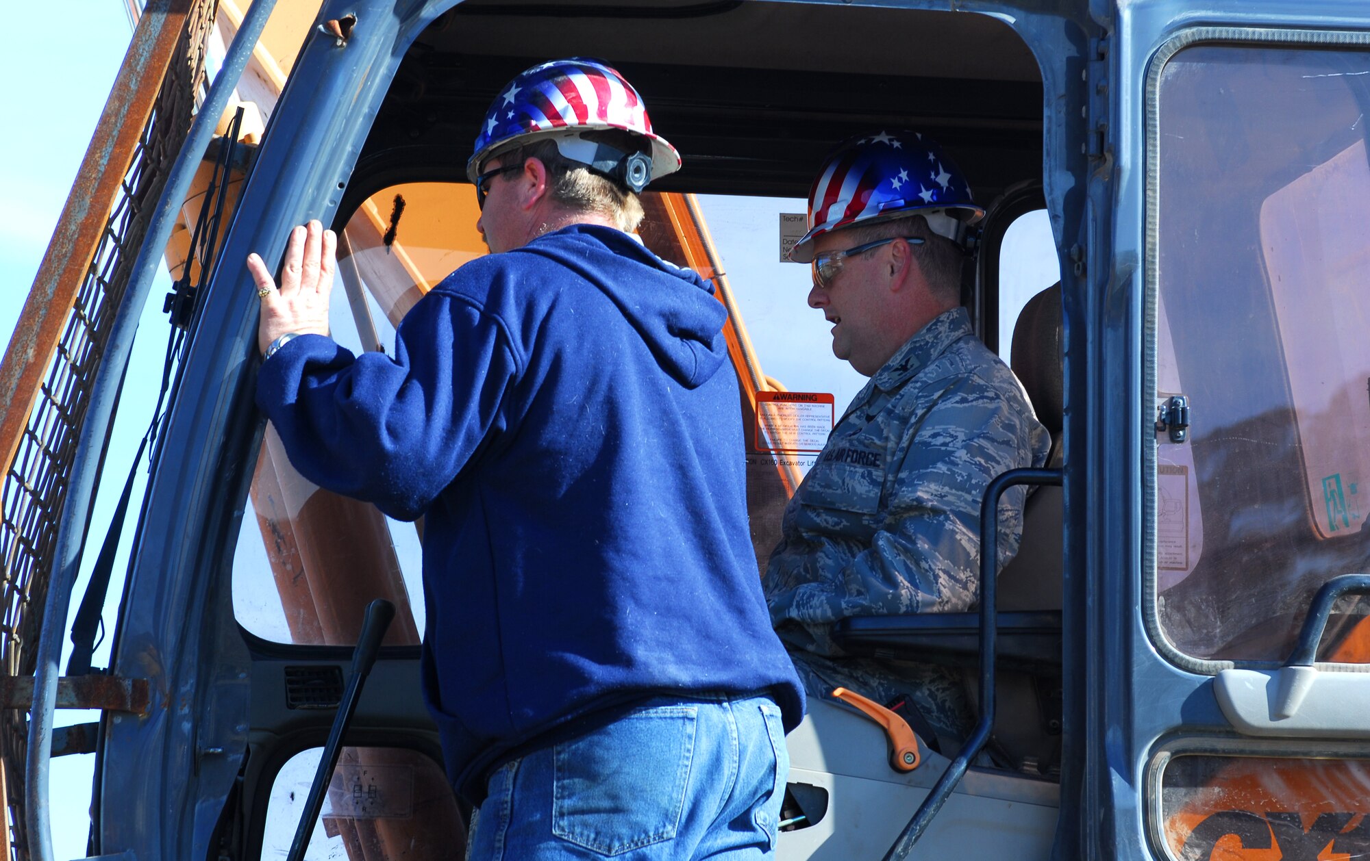 Col. Brad Webb, 1st Special Operations Wing Commander, knocks the first blow to the building that formerly housed the 20th Special Operations Squadron and wing plans and programs in a demolition Dec. 6. A new crash/rescue facility for the 1st Special Operations Civil Engineer Squadron Fire Emergency Services Flight will be built at the site. (U.S. Air Force photo/Airman 1st Class Jason Epley) 