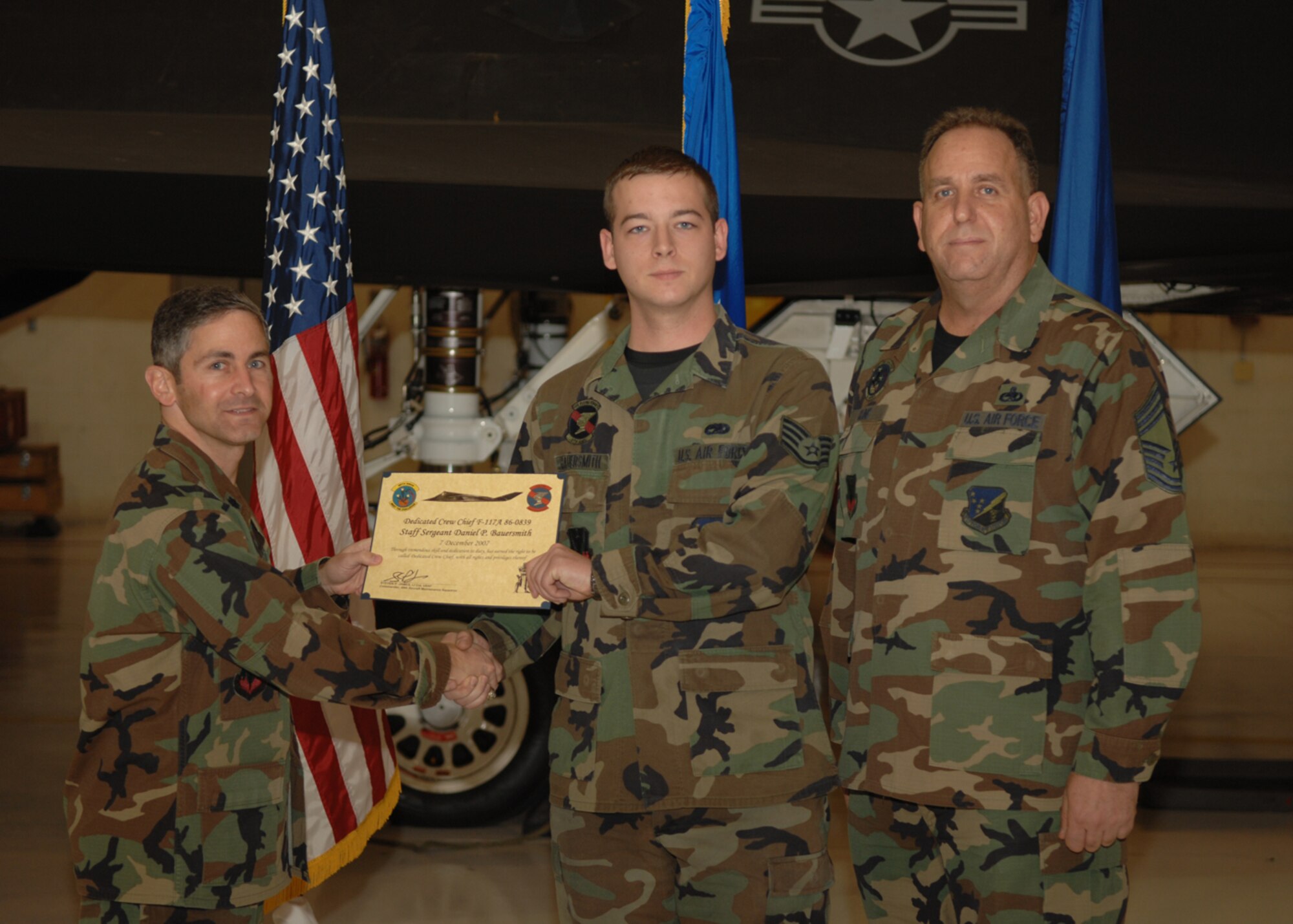 The 49th Aircraft Maintenance Squadron recognizes eight crew chiefs during the Dedicated Crew Chief Appointment Ceremony Dec. 7, 2007, at Holloman Air Force Base, N.M. To be a Dedicated Crew Chief, an Airman must have a minimum of six months' experience and be a staff sergeant or higher or be a waivered Senior Airman. A Dedicated Crew Chief is responsible for all maintenance on the aircraft he/she has assigned. (U.S. Air Force photo/Airman 1st Class Jamal D. Sutter)