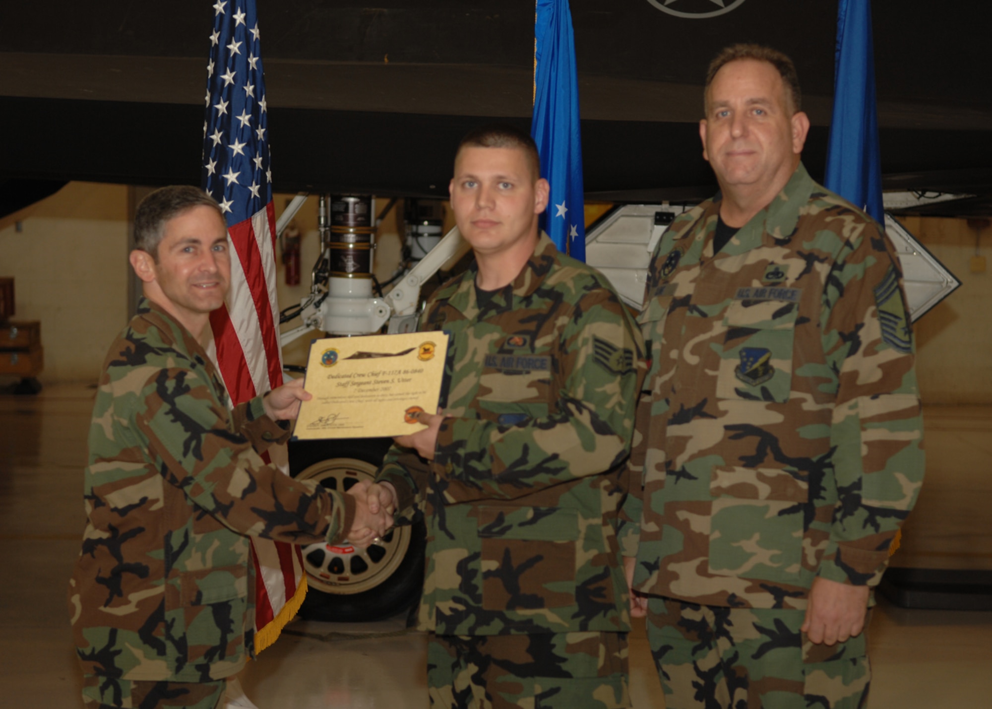 The 49th Aircraft Maintenance Squadron recognizes eight crew chiefs during the Dedicated Crew Chief Appointment Ceremony Dec. 7, 2007, at Holloman Air Force Base, N.M. To be a Dedicated Crew Chief, an Airman must have a minimum of six months' experience and be a staff sergeant or higher or be a waivered Senior Airman. A Dedicated Crew Chief is responsible for all maintenance on the aircraft he/she has assigned. (U.S. Air Force photo/Airman 1st Class Jamal D. Sutter)