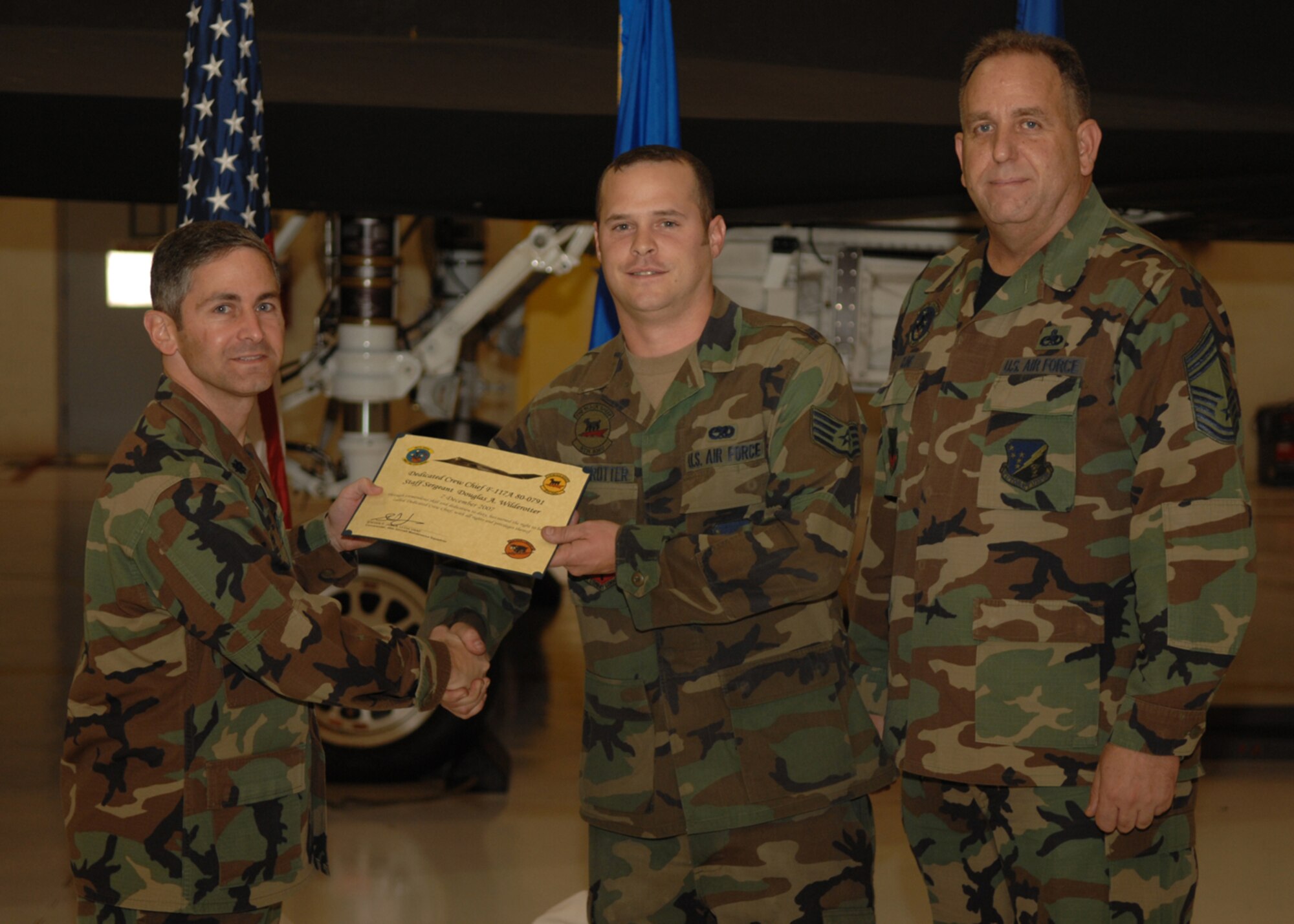The 49th Aircraft Maintenance Squadron recognizes eight crew chiefs during the Dedicated Crew Chief Appointment Ceremony Dec. 7, 2007, at Holloman Air Force Base, N.M. To be a Dedicated Crew Chief, an Airman must have a minimum of six months' experience and be a staff sergeant or higher or be a waivered Senior Airman. A Dedicated Crew Chief is responsible for all maintenance on the aircraft he/she has assigned. (U.S. Air Force photo/Airman 1st Class Jamal D. Sutter)