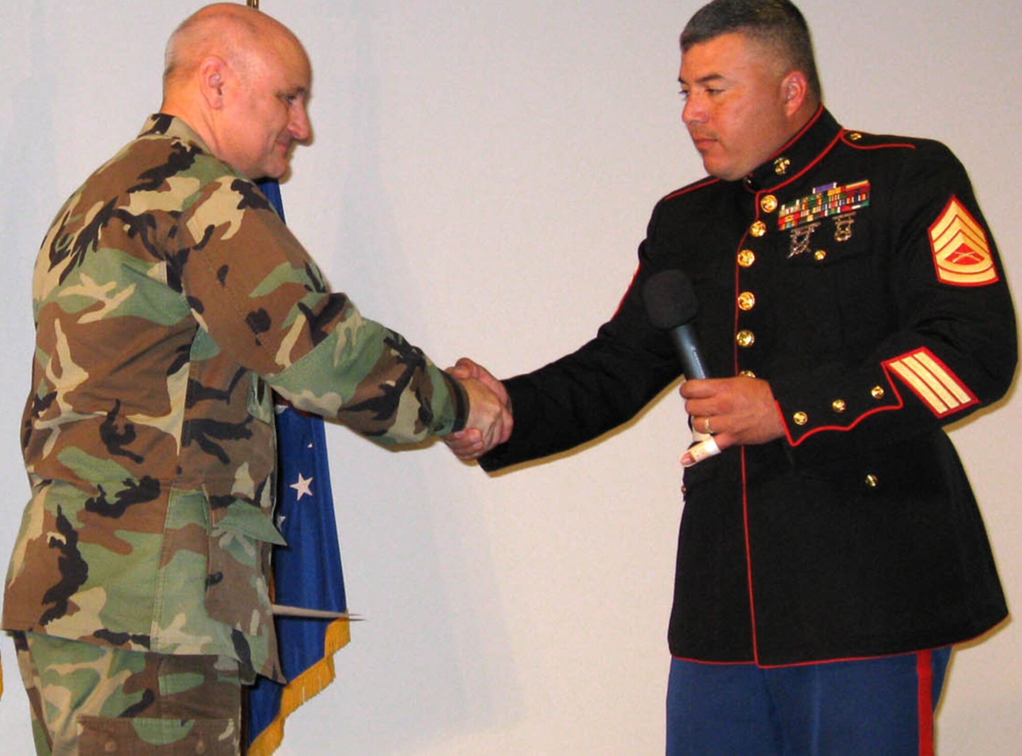 GPS Wing Commander Col. David Madden welcomes Gunnery Sgt. Gerardo Bentatcorte from the Marine Corps Toys for Tots Foundation. The GPS Wing is spearheading the toy drive this year. More than 150 toys have been collected on base. Donations will continue in the bins located in Bldg. 271 and the BX through Dec. 21. 