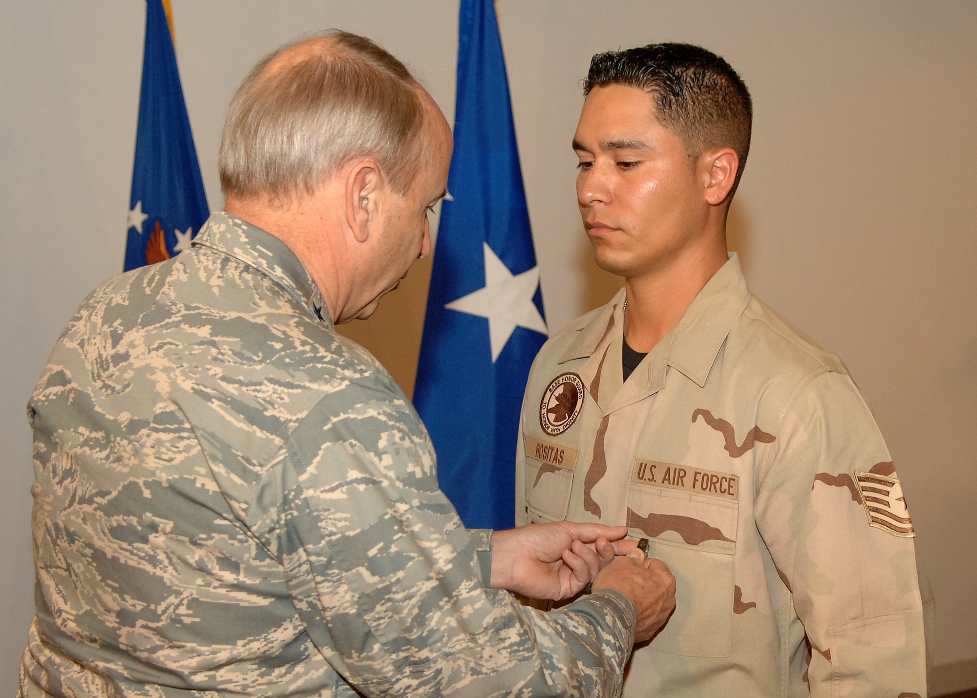 Tech. Sgt. Richard Rositas, Space Superiority Systems Wing, received the Air Force Commendation Medal at the Welcome Home ceremony for service during a deployment to Iraq. Five medals were presented to individuals at the ceremony, Dec. 6. (Photo by Stephen Schester)