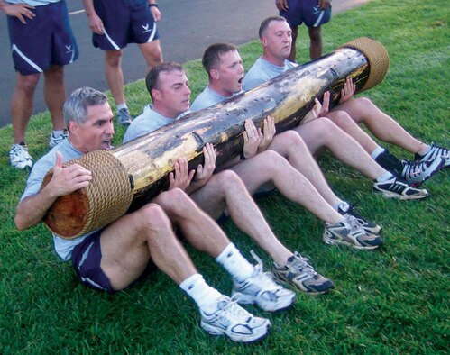 Col. JJ Torres, 15th Airlift Wing commander (left) doing sit-ups with members from the 25th ASOS after a warrior run. A self-disciplined Airman regularly maintains strength, endurance and health through challenging physical activity. (USAF photo/Staff. Sgt. Erin Smith)

