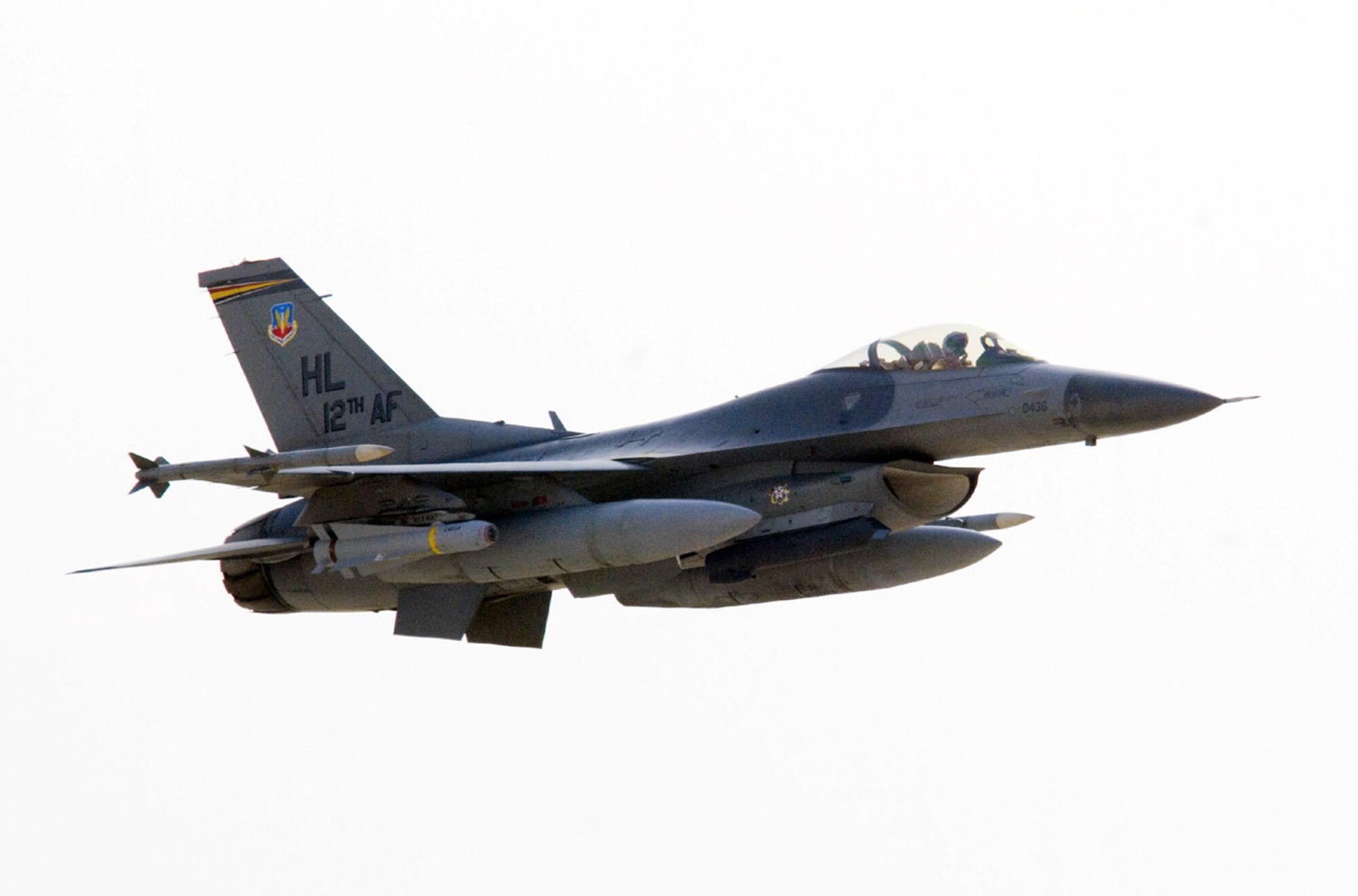 An F-16 Fighting Falcon flies over Iraq in support of Operation Iraqi Freedom. F-16s destroyed a weapons cache in Baghdad and struck an IED emplacement team in Kirkuk Dec. 9. An F-16 also performed a show of force in Al kut. (U.S. Air Force photo/Master Sgt. John Nimmo, Sr.) 