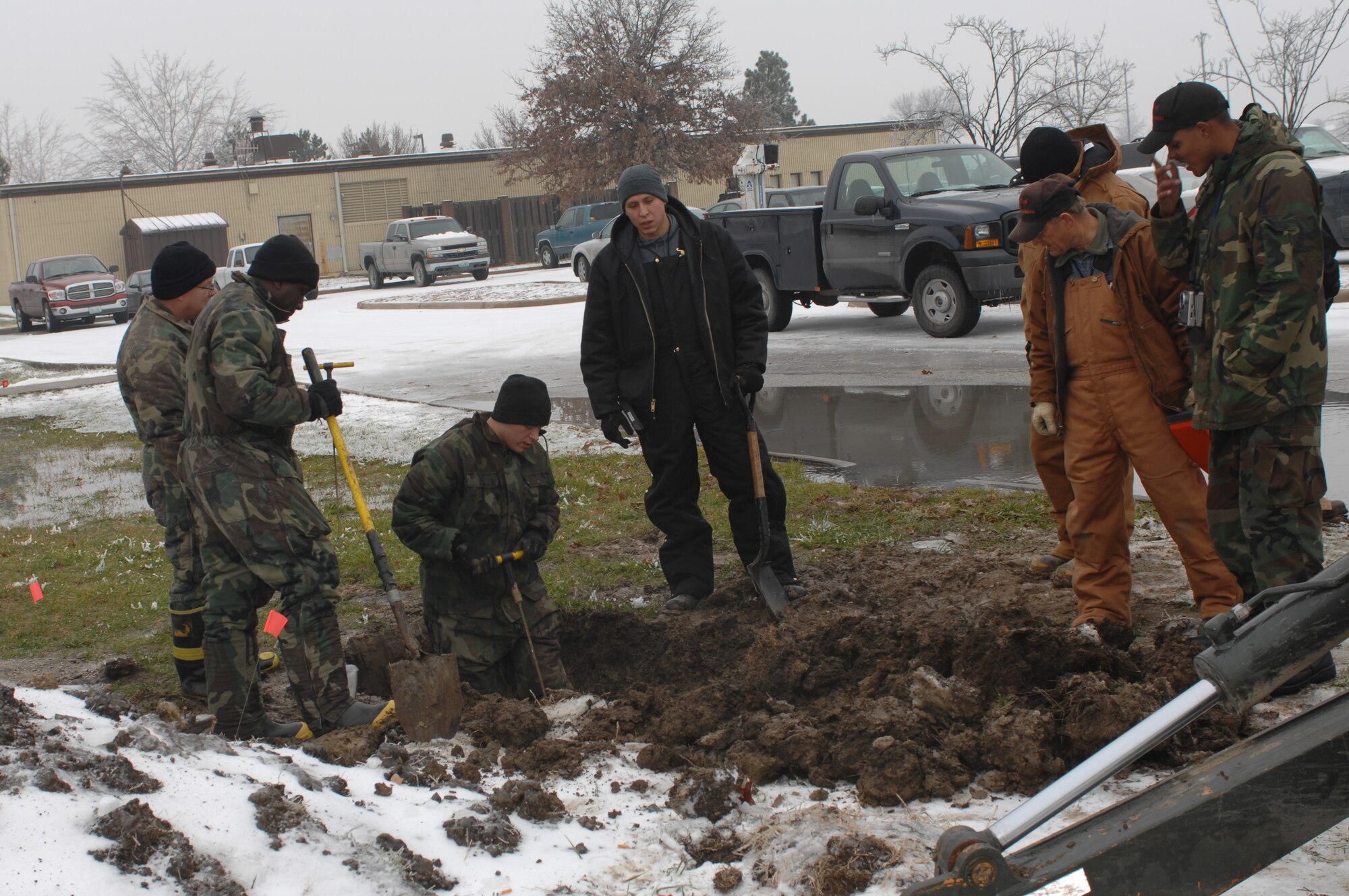 WHITEMAN AIR FORCE BASE, Mo. – Members of the 509th Civil Engineer Squadron probe for a broken water line Dec. 10. (U.S. Air Force photo/Tech. Sgt. Samuel A. Park)