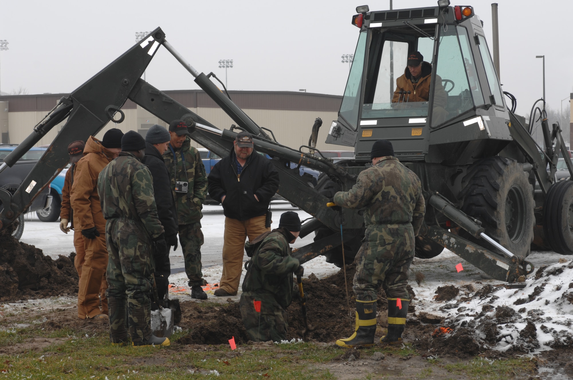 WHITEMAN AIR FORCE BASE, Mo. – Members of the 509th Civil Engineer Squadron probe for a broken water main line Dec. 10. The water break is projected to be fixed by 7 P.M. tonight.  (U.S. Air Force photo/Tech. Sgt. Samuel A. Park)