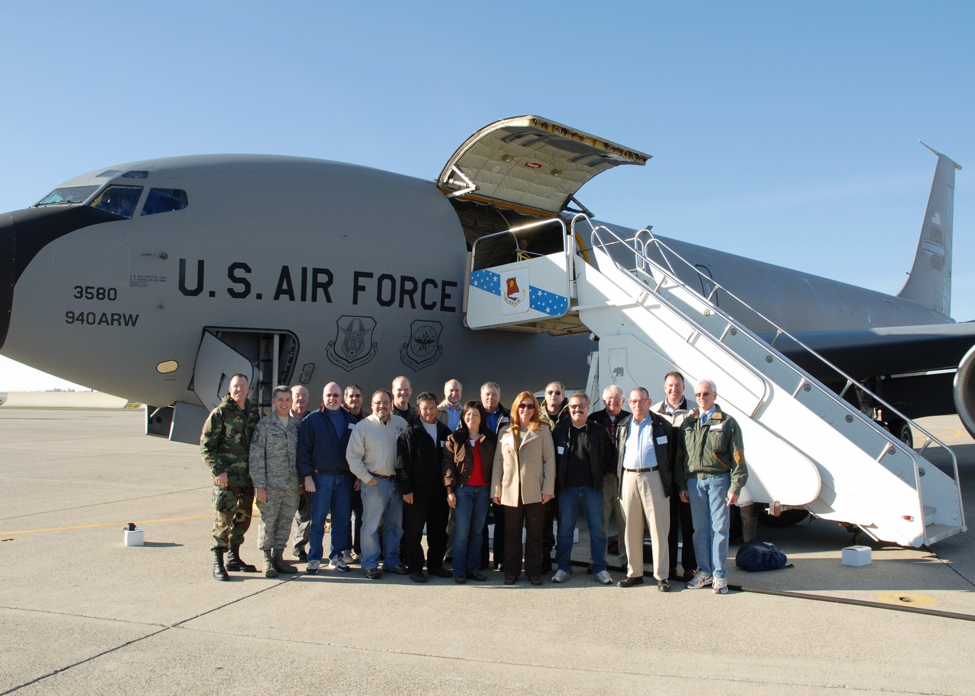 Civilian honorary commanders and Beale Air Force Base leaders pose for a group photograph prior to an orientation flight on an Air Force Reserve KC-135R Stratotanker, assigned to the 940th Air Refueling Wing Dec. 10, 2007.  Honorary commanders are local civic leaders paired with military commanders, each sharing experiences in order to strengthen the relationship between the military and civilian communities. The air refueling mission over Northern California provided fuel to a Travis Air Force Base, Calif,. KC-10A Extender on a routine training mission. (U.S. Air Force photo / Maj. Robert Couse-Baker)