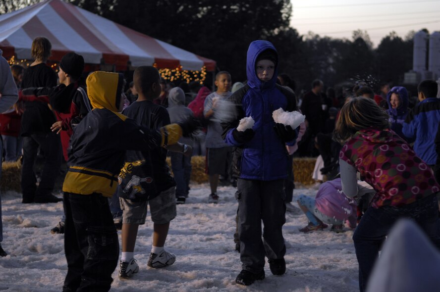MOODY AIR FORCE BASE, Ga. -- Team Moody children play with snow at the Moody Air Force Base tree lighting ceremony Dec 7. The ceremony also included a parade and a visit from Mr. and Mrs. Claus. (U.S. Air Force photo by Senior Airman ELizabeth Rissmiller) 