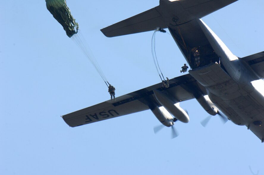 MOODY AIR FORCE BASE, Ga. — Members from the 822nd Security Forces Squadron jump out of an HC-130P here Dec 9.  Members are required to jump monthly to maintain proficiency. (U.S. Air Force photo by Senior Airman Angelita Lawrence)     