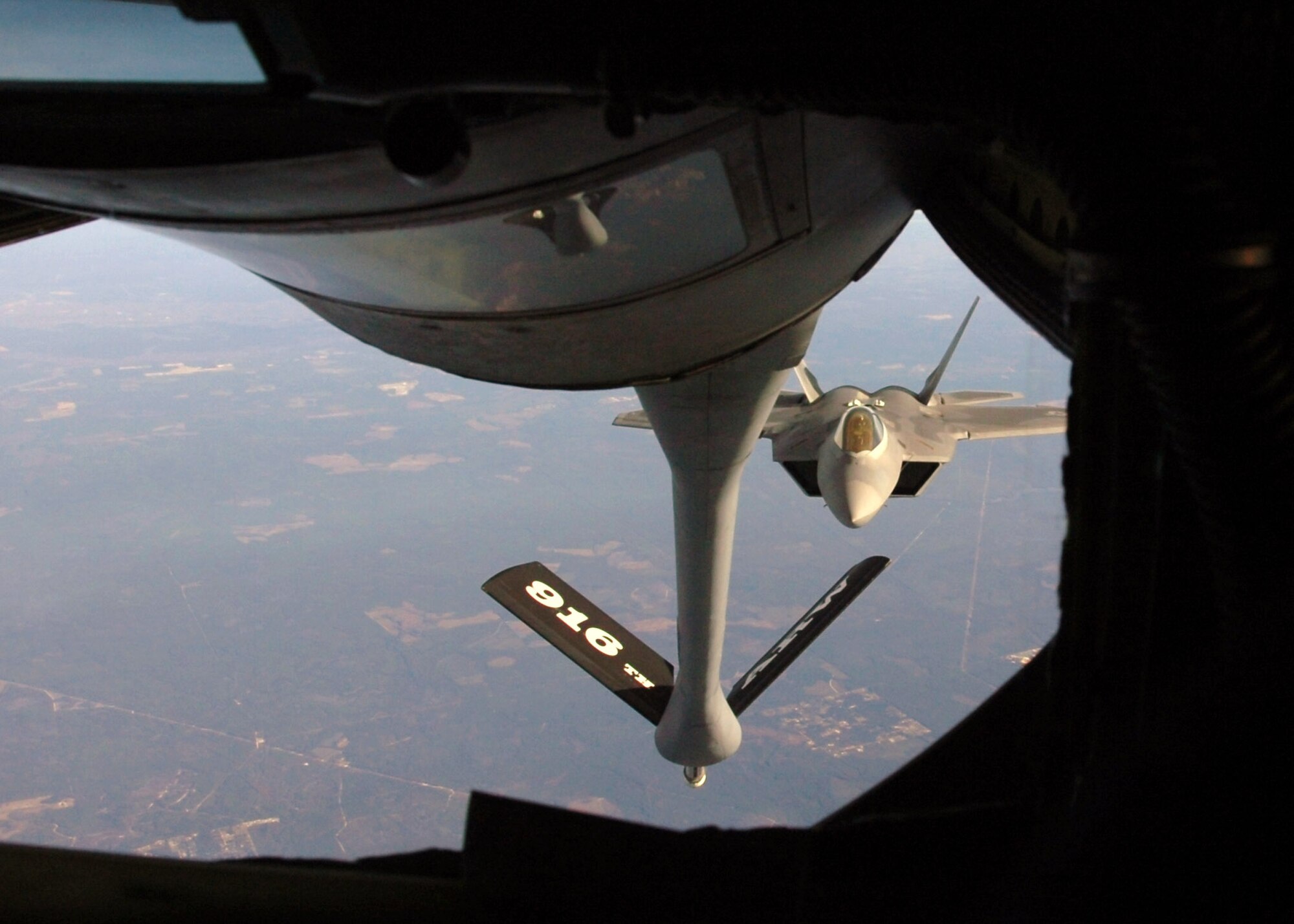 An F-22 Raptor lines up with a KC-135 Stratotanker during an air-to-air refueling training mission Dec. 4 over Eglin Air Force Base, Fla. The F-22 is from the 43rd Fighter Squadron at Tyndall AFB, Fla. The KC-135 is from the 916th Air Refueling Wing, an Air Force Reserve wing located at Seymour Johnson AFB, N.C. (U.S. Air Force photo/Staff Sgt. Bryan Franks) 
