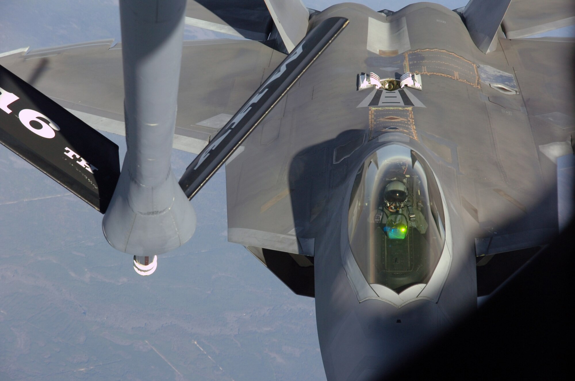 An F-22 Raptor lines up with a KC-135 Stratotanker during an air-to-air refueling training mission Dec. 4 over Eglin Air Force Base, Fla. The F-22 is from the 43rd Fighter Squadron at Tyndall AFB, Fla. The KC-135 is from the 916th Air Refueling Wing, an Air Force Reserve wing located at Seymour Johnson AFB, N.C. (U.S. Air Force photo/Staff Sgt. Bryan Franks) 
