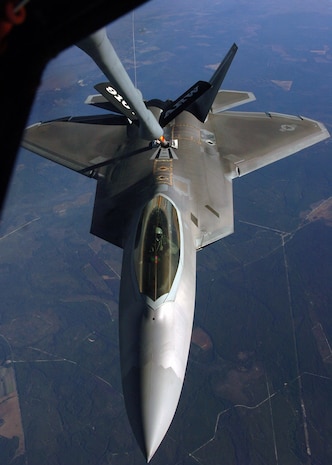An F-22 Raptor receives fuel from a KC-135 Stratotanker during an air-to-air refueling training mission Dec. 4 over Eglin Air Force Base, Fla. The F-22 is from the 43rd Fighter Squadron at Tyndall AFB, Fla. The KC-135 is from the 916th Air Refueling Wing, an Air Force Reserve wing located at Seymour Johnson AFB, N.C.  (U.S. Air Force photo/Staff Sgt. Bryan Franks)