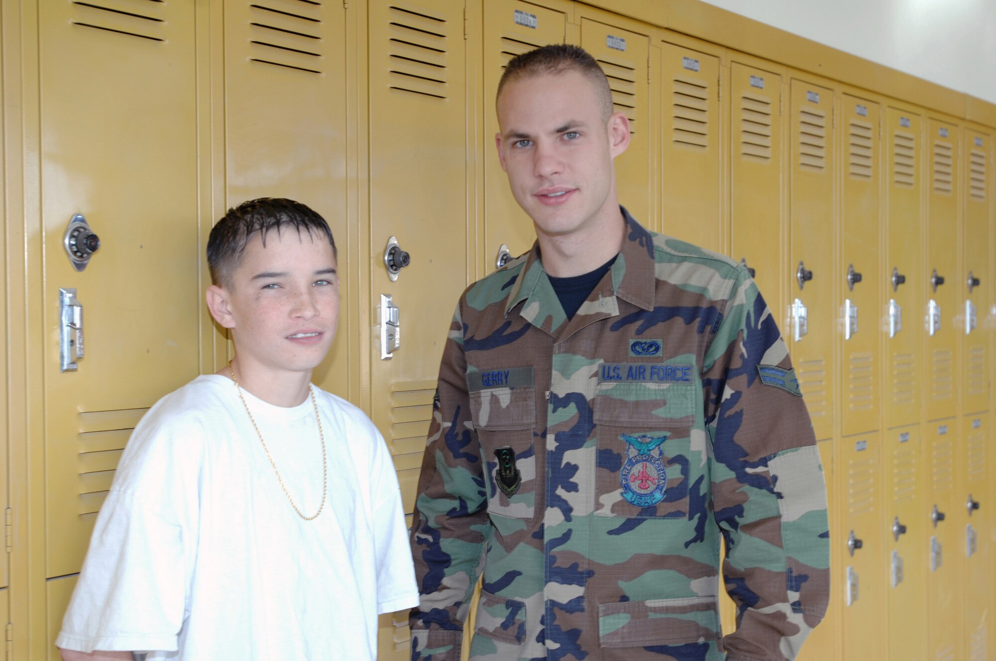CANNON AIR FORCE BASE, N.M. -- Chris Lee, a 12-year old seventh-grader at Yucca Middle School, meets regularly with Airman 1st Class Robert Jerry, 27th Special Operations Civil Engineer Squadron. Airman Gerry mentors Chris to help him do better in school, and is one of 22 Cannon Airmen who not only works with students with their studies, but provide positive role models as well. (Air Force photo by Greg Allen)