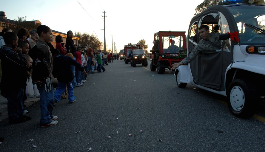 MOODY AIR FORCE BASE, Ga. -- Members of Team Moody and their dependents attend the base Christmas parade Nov. 7 . The evening also included a special visit by Mr. and Mrs. Claus and a tree lighting ceremony. (U.S. Air Force photo by Airman 1st Class Gina Chiaverotti)