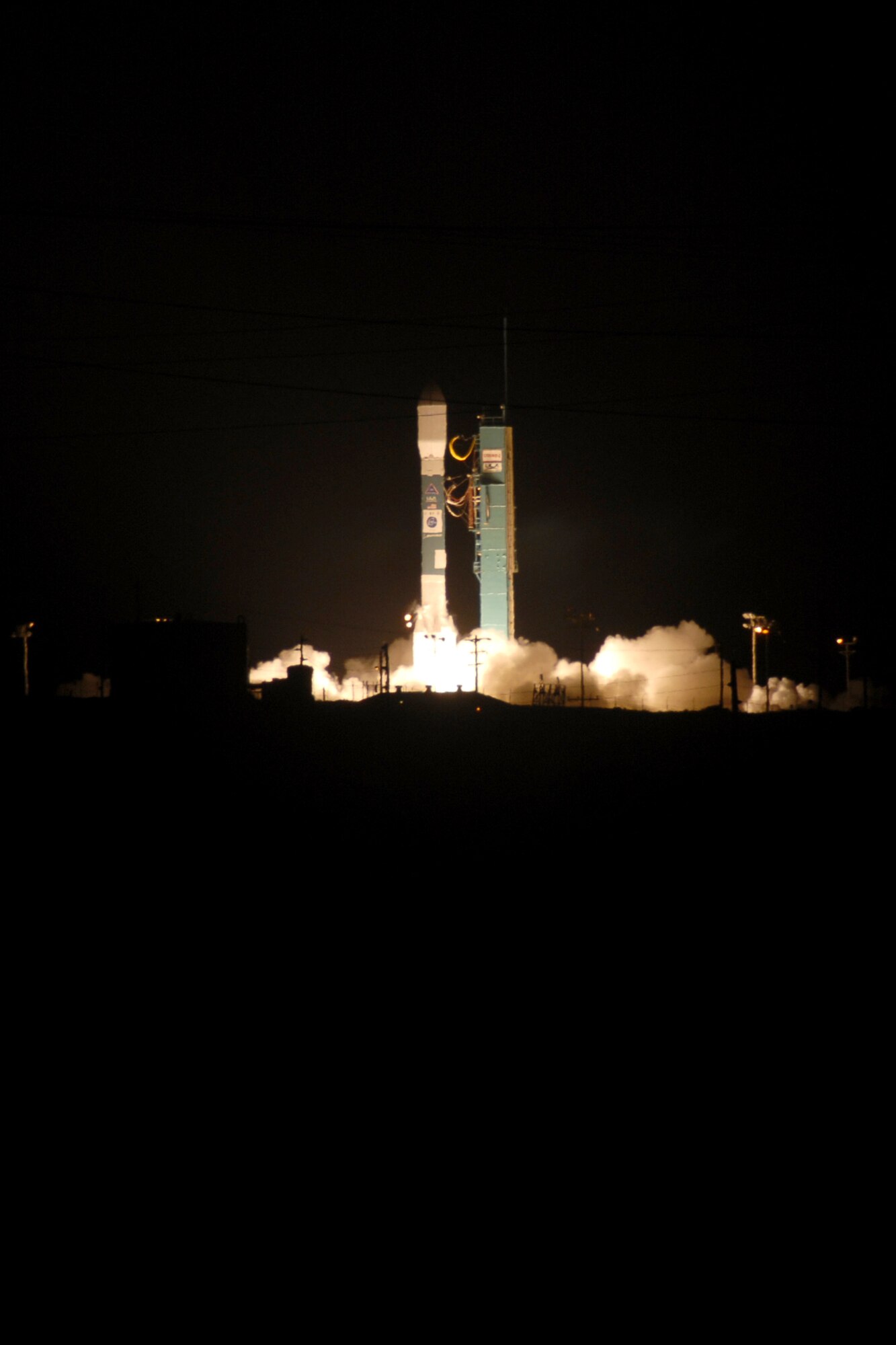 VANDENBERG AIR FORCE BASE, Calif. -- A Delta II rocket carrying the Thales Alenia-Space COSMO-SkyMed Satellite launched from Vandenberg on Dec. 8 at 6:31 p.m. The rocket, second of two COSMO-SkyMed launches scheduled from Vandenberg, took off from Space Launch Complex-2. The Delta II is an expendable launch, medium-lift vehicle. It carries civil and commercial payloads into low-earth, polar, geosynchronous transfer and stationary orbits. (U.S. Air Force Photo/Robert Hargreaves