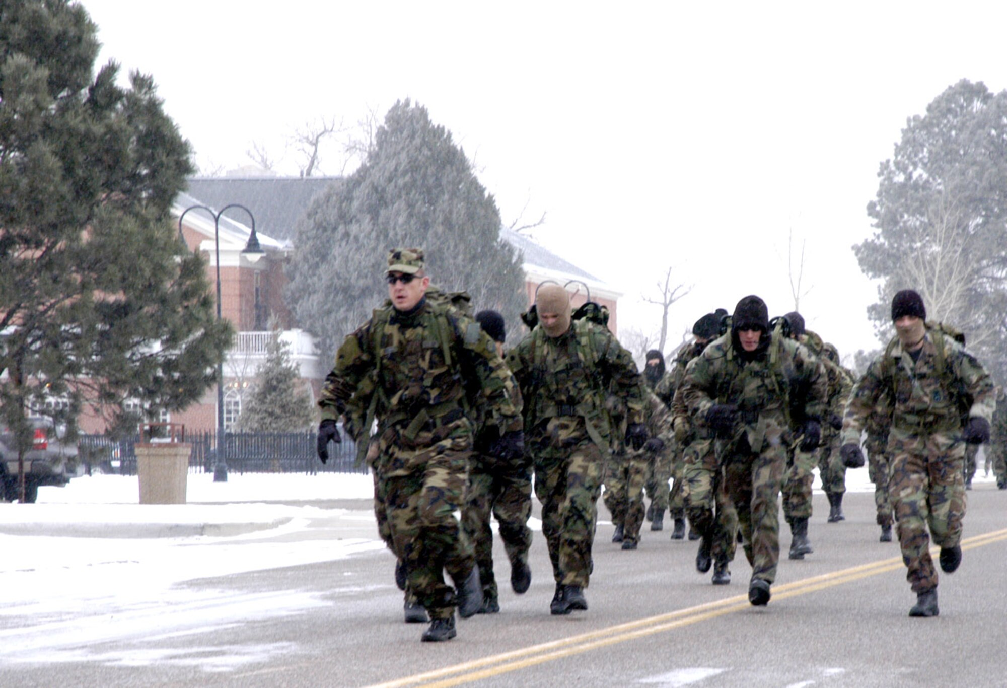 Participants of the Chosin Reservoir Commemorative March run into stong winds. Many of the first teams chose to run the six-mile distance (Photo by Tech. Sgt. Kurt Arkenberg).