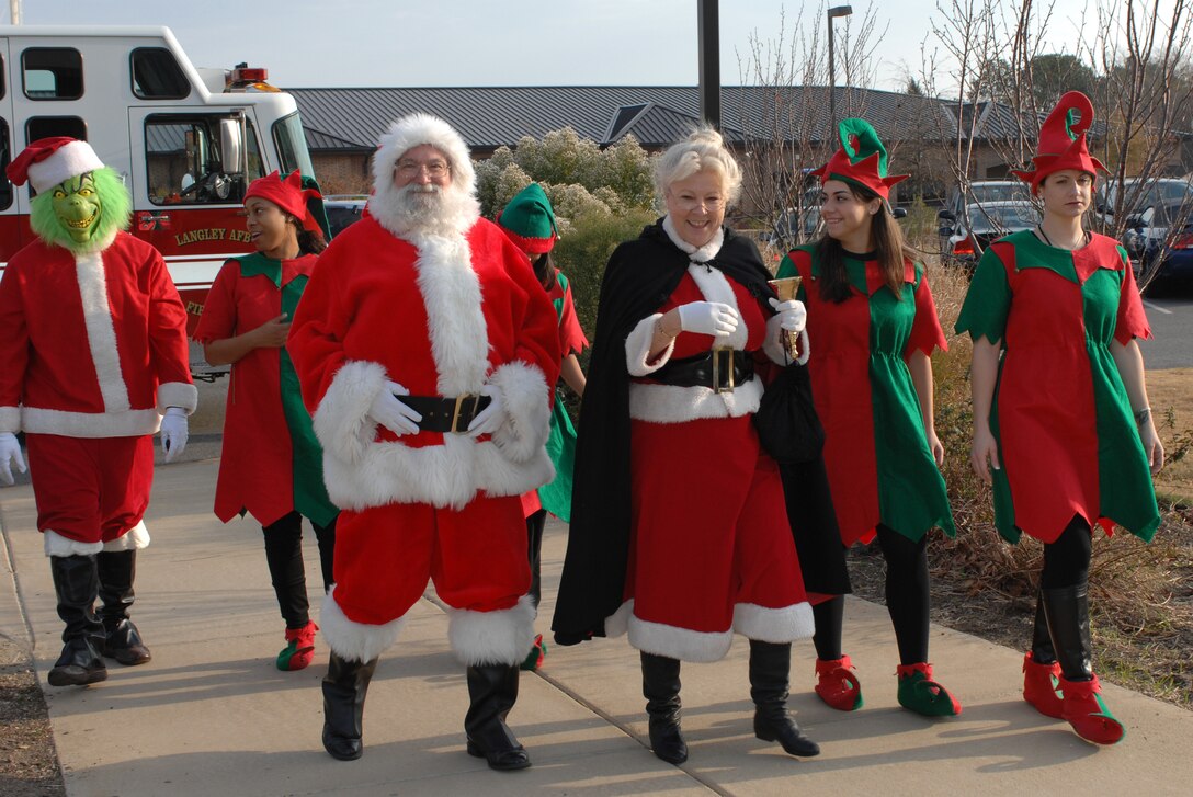 LANGLEY AIR FORCE BASE, Va.--The Grinch, Santa Claus, Mrs. Claus and elves arrive at the Shellbank Youth Center for "Breakfast With Santa" Dec. 8.  Santa came to listen to children’s Christmas wishes. More than 800 people attended the event, which consisted of many activities including breakfast, writing letters to Santa and decorating ornaments. (U.S. Air Force photo/Staff Sgt. April Wickes)