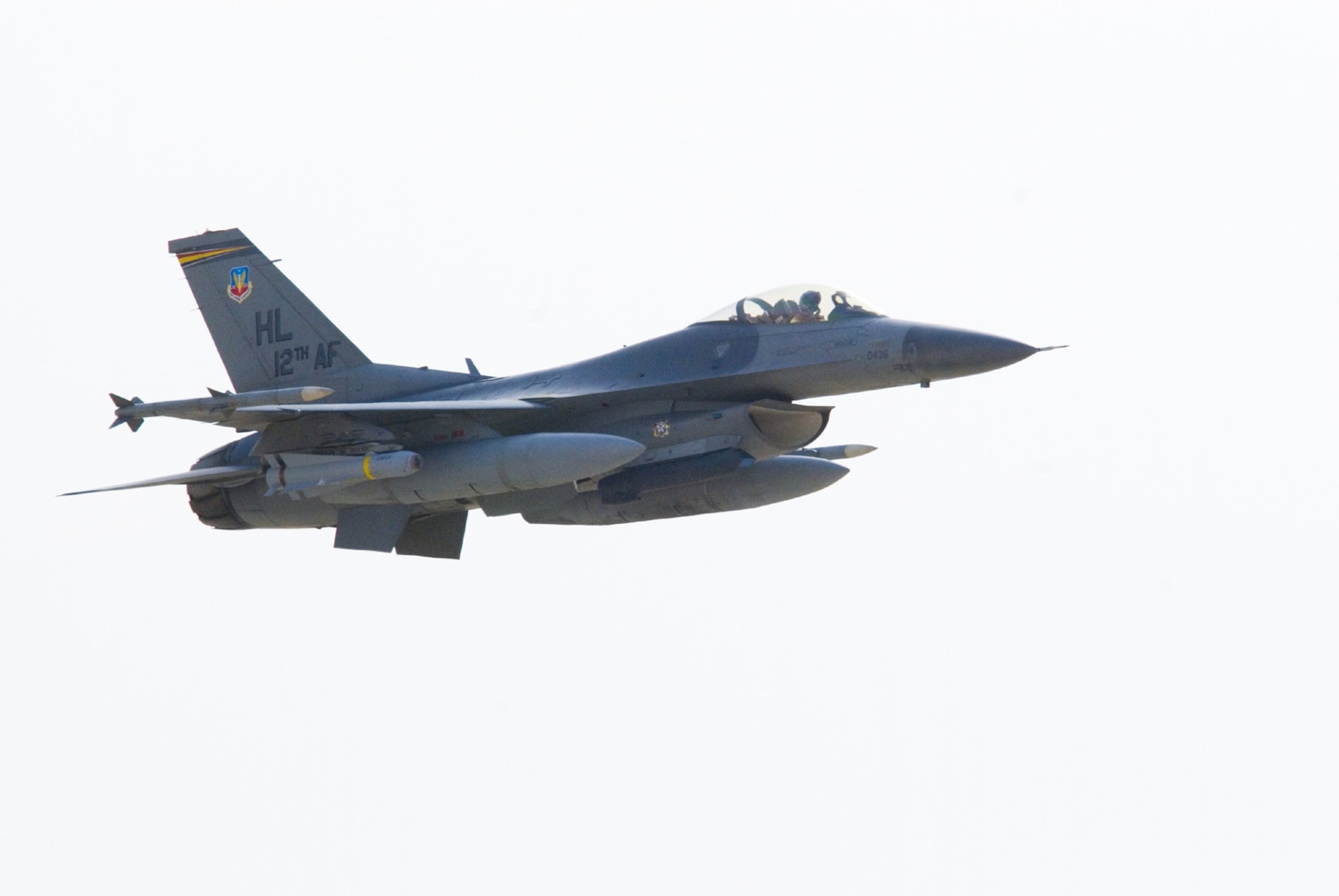 An F-16 flies over Iraq in support of Operation Iraqi Freedom. F-16s destroyed a weapons cache in Baghdad and struck an IED emplacement team in Kirkuk Dec. 9. An F-16 also performed a show of force in Al Kut. (U.S. Air Force photo by Master Sgt. John Nimmo, Sr.)