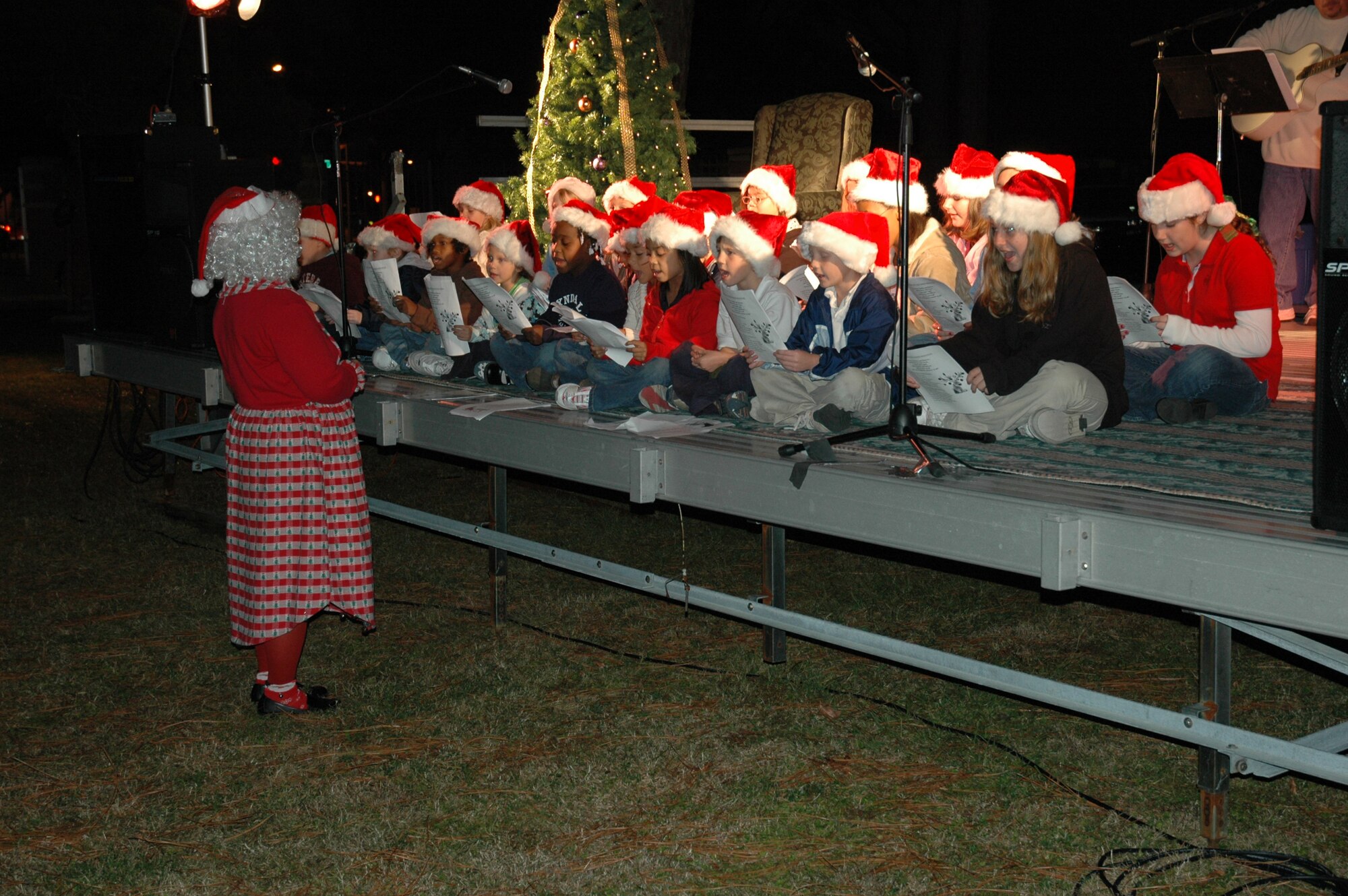 The Tyndall Youth Center Singing Club sang Christmas songs along with Tyndall's annual Christmas tree lighting Dec. 6.  The children range from five years old to twelve years old. (Air Force photo by Airman 1st Class Anthony J. Hyatt)