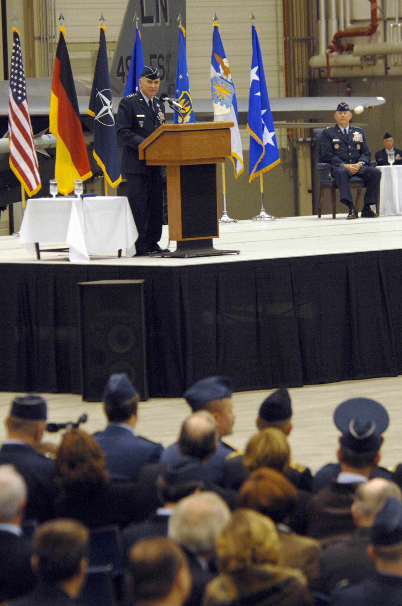 Gen. William T.  Hobbins, U.S. Air Forces in Europe commander addresses the crowd as Air Force Chief of Staff Gen. T. Michael Moseley looks on during Gen. Hobbins retirement ceremony Ramstein Air Base, Germany, Dec. 10.  (U.S. Air Force photo by TSgt Kenneth Bellard)(Released).