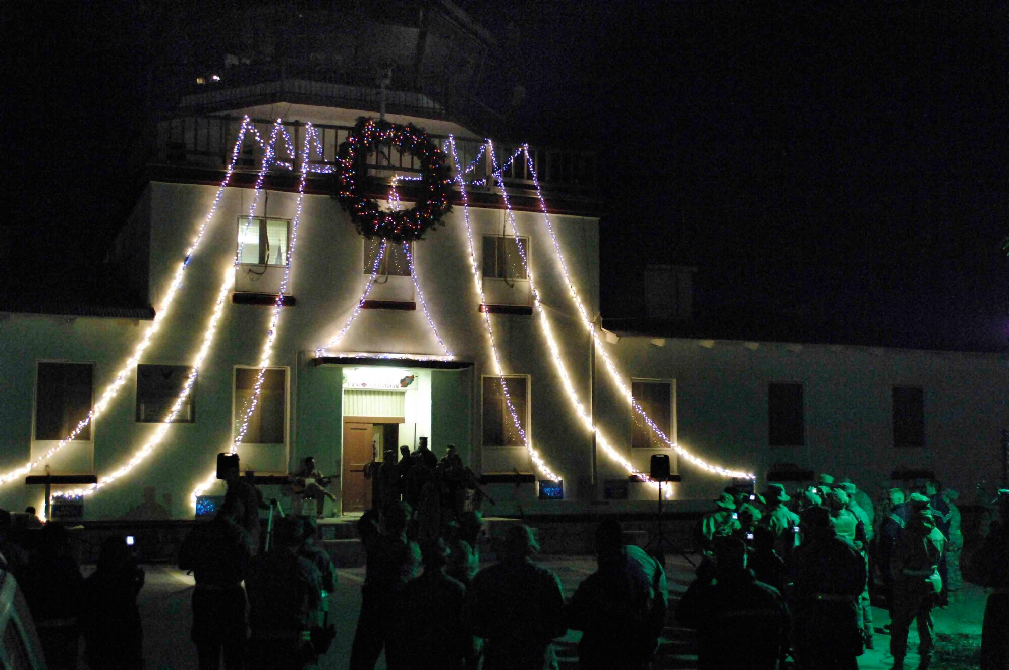 BAGRAM AIR BASE, Afghanistan – Members of the 455th Air Expeditionary Wing gather to celebrate the holidays during a tower lighting in Camp Cunningham here, Nov. 8. (U.S. Air Force Photo by Staff Sgt. Josh Jasper)