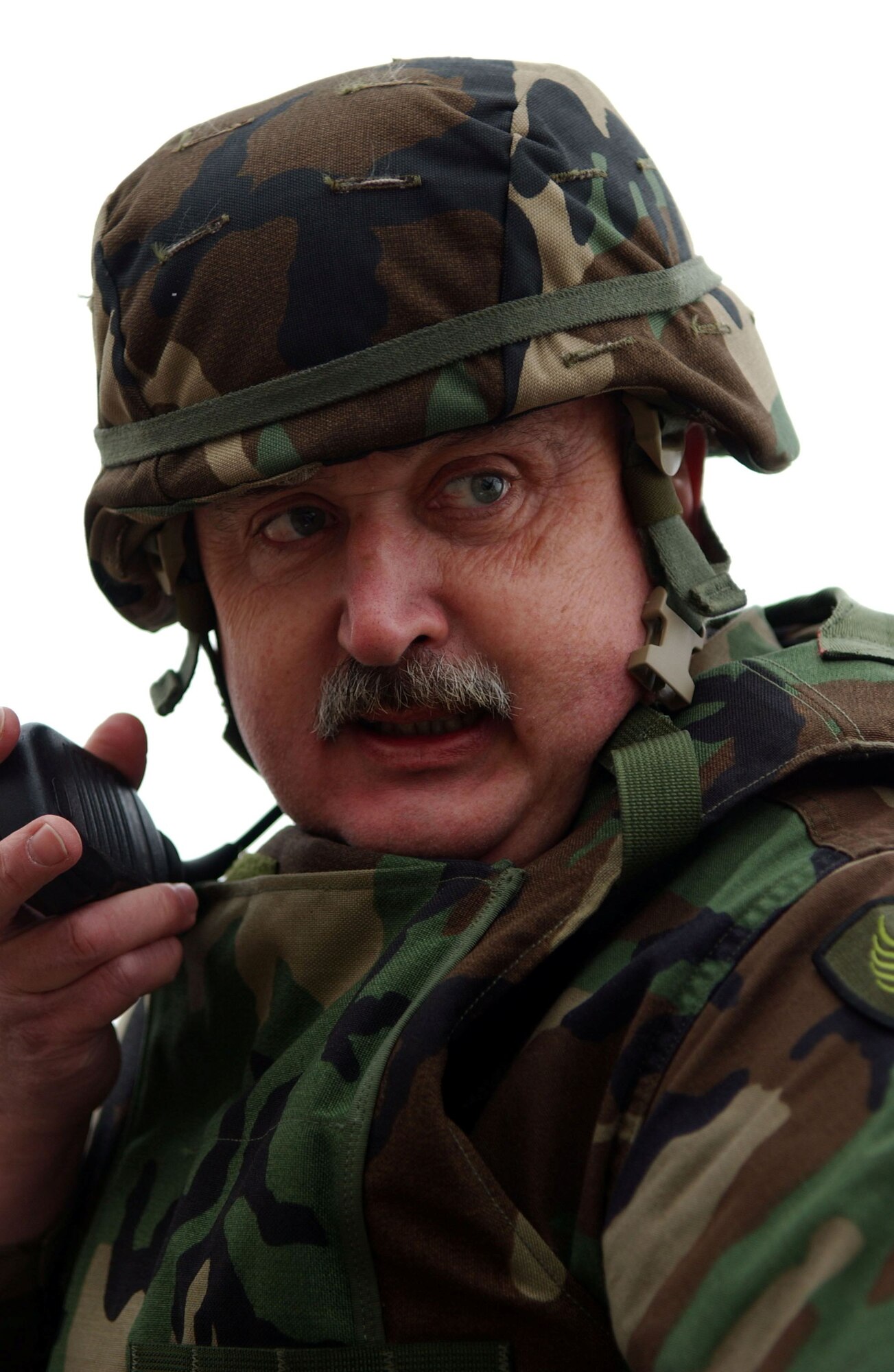 SPANGDAHLEM AIR BASE, Germany -- Police Officer 1st Class Andreas Gerlach, a 52nd Security Forces Squadron Civilian Service Unit police officer, radios for additional units to respond to a simulated mass-casualty exercise held as part of a base-wide training week here. (U.S. Air Force photo/Senior Airman Matthew S. Bright) 