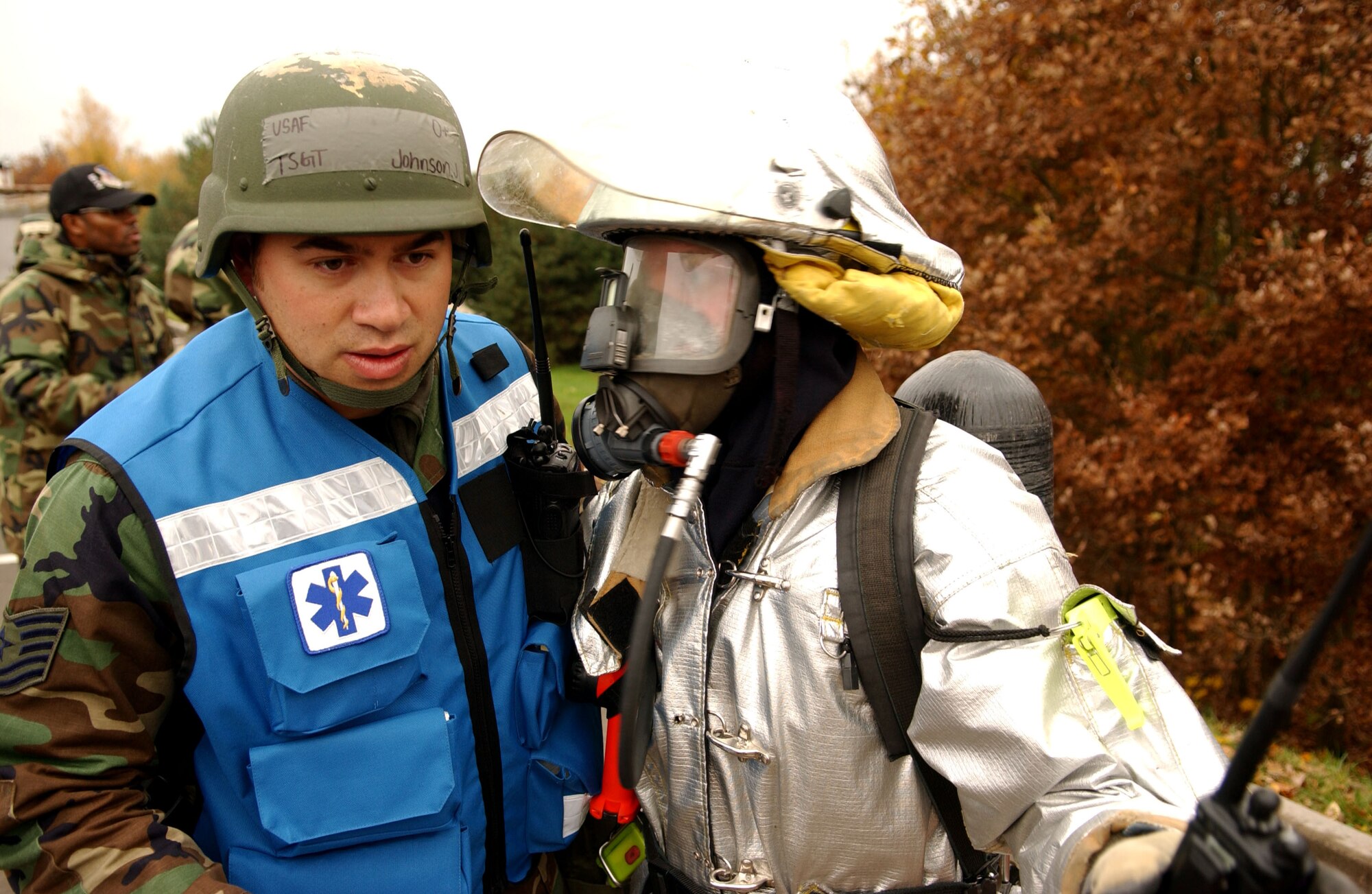 SPANGDAHLEM AIR BASE, Germany – Tech. Sgt. Jeffrey Johnson, 52nd Medical Operations Squadron ambulance service, is briefed on the condition of simulated casualties by Staff Sgt. Thomas Tormey, 52nd Civil Engineering Squadron rescue crew chief, during a mass-casualty exercise held as part of a base-wide training week here. (U.S. Air Force photo/Senior Airman Matthew S. Bright) 