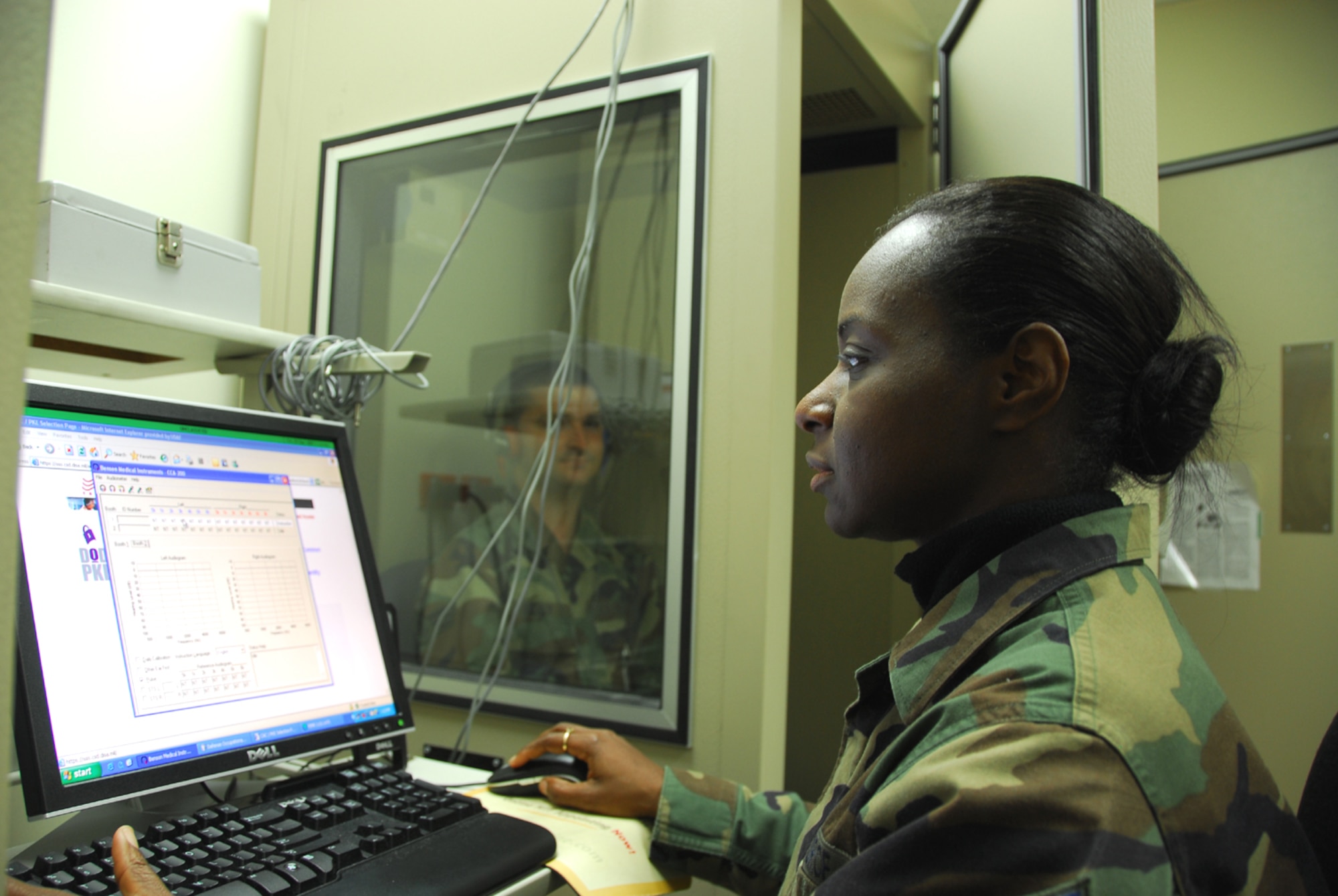 OSAN AIR BASE, Republic of Korea --  Master Sgt. Tressie Anderson-Bolden, the public health flight chief with the 51st Aerospace Medicine Squadron, administers an audiogram, which analyzes a person’s hearing levels. Sergeant Anderson-Bolden received the Pacific Air Forces' Col. Cleveland L. Parker Public Health Award. (U.S. Air Force photo by Staff Sgt. Ronnie Hill)