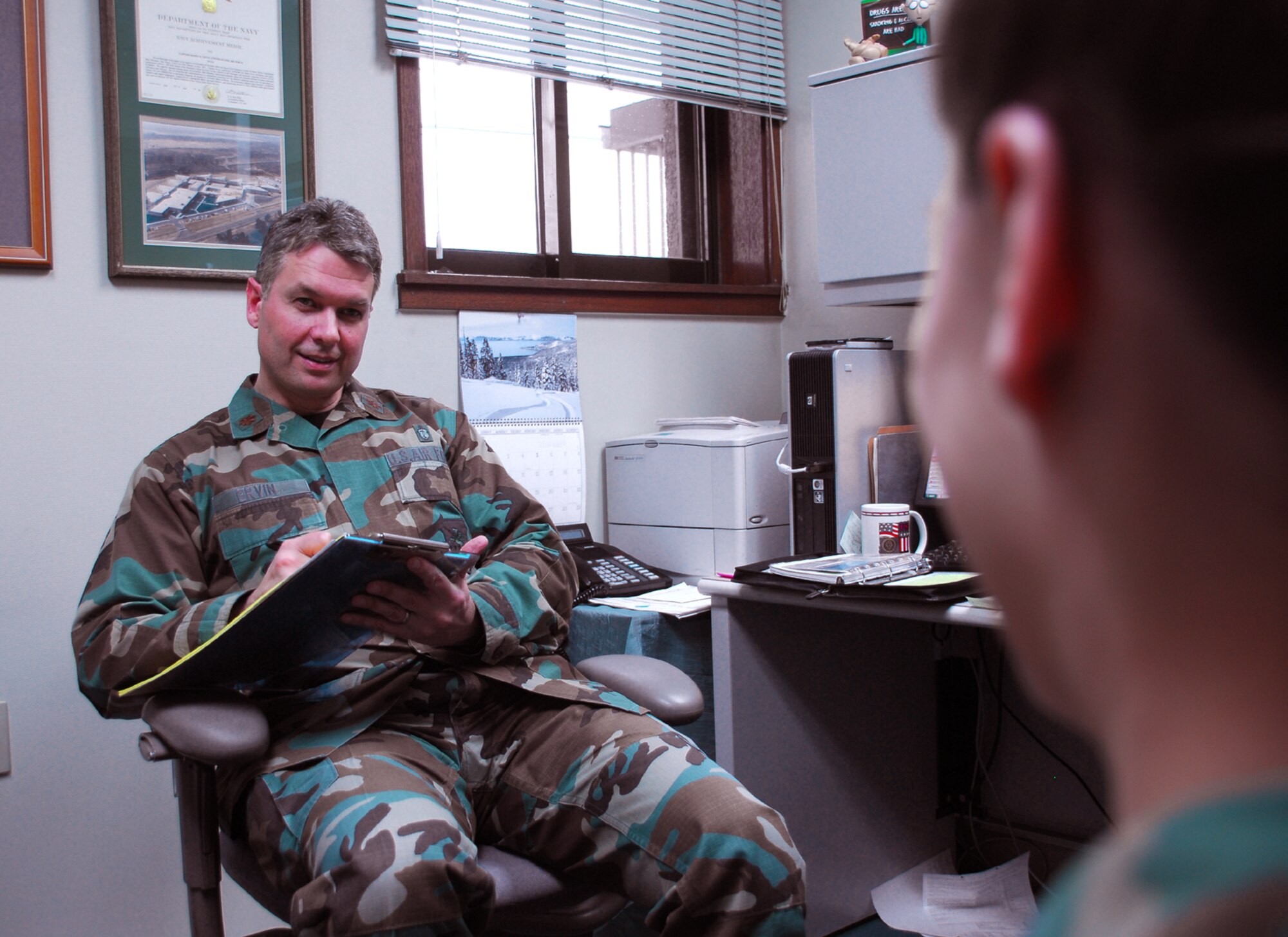 OSAN AIR BASE, Republic of Korea --  Maj. Danny Ervin, mental health flight commander with the 51st Medical Operations Squadron, conducts a mental health interview. Major Ervin was selected as Pacific Air Forces' Social Worker of the Year. (U.S. Air Force photo Staff Sgt. Ronnie Hill)